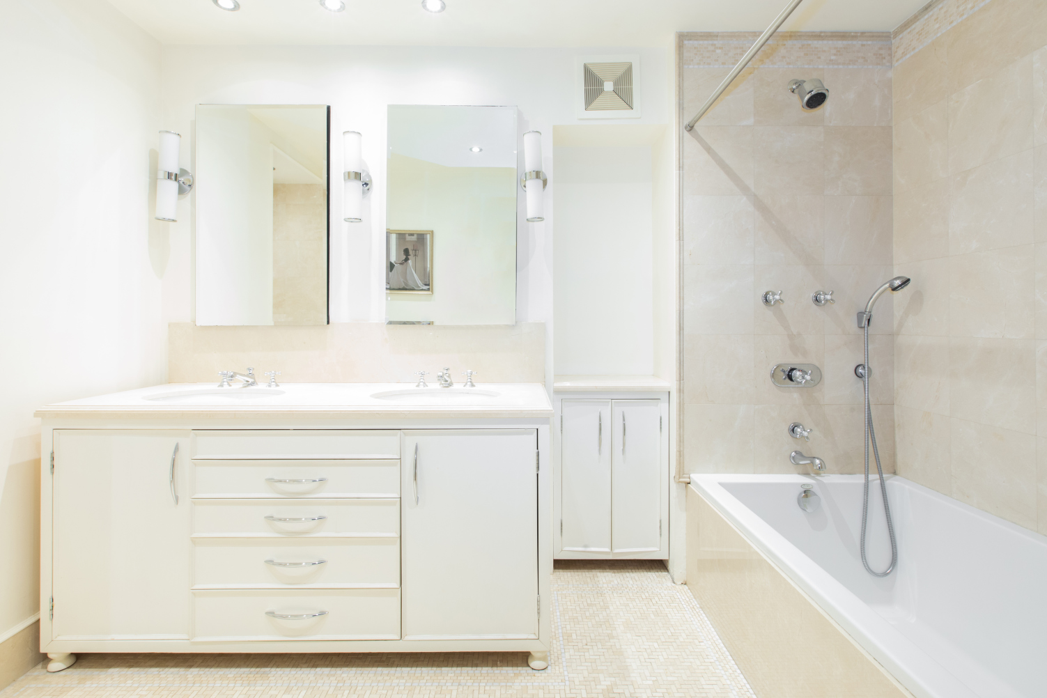 27 West 87th Street, Unit 1 Manhattan, NY 10024 - Photo 8 of 12 a bathroom with a sink a mirror a bathtub and shower