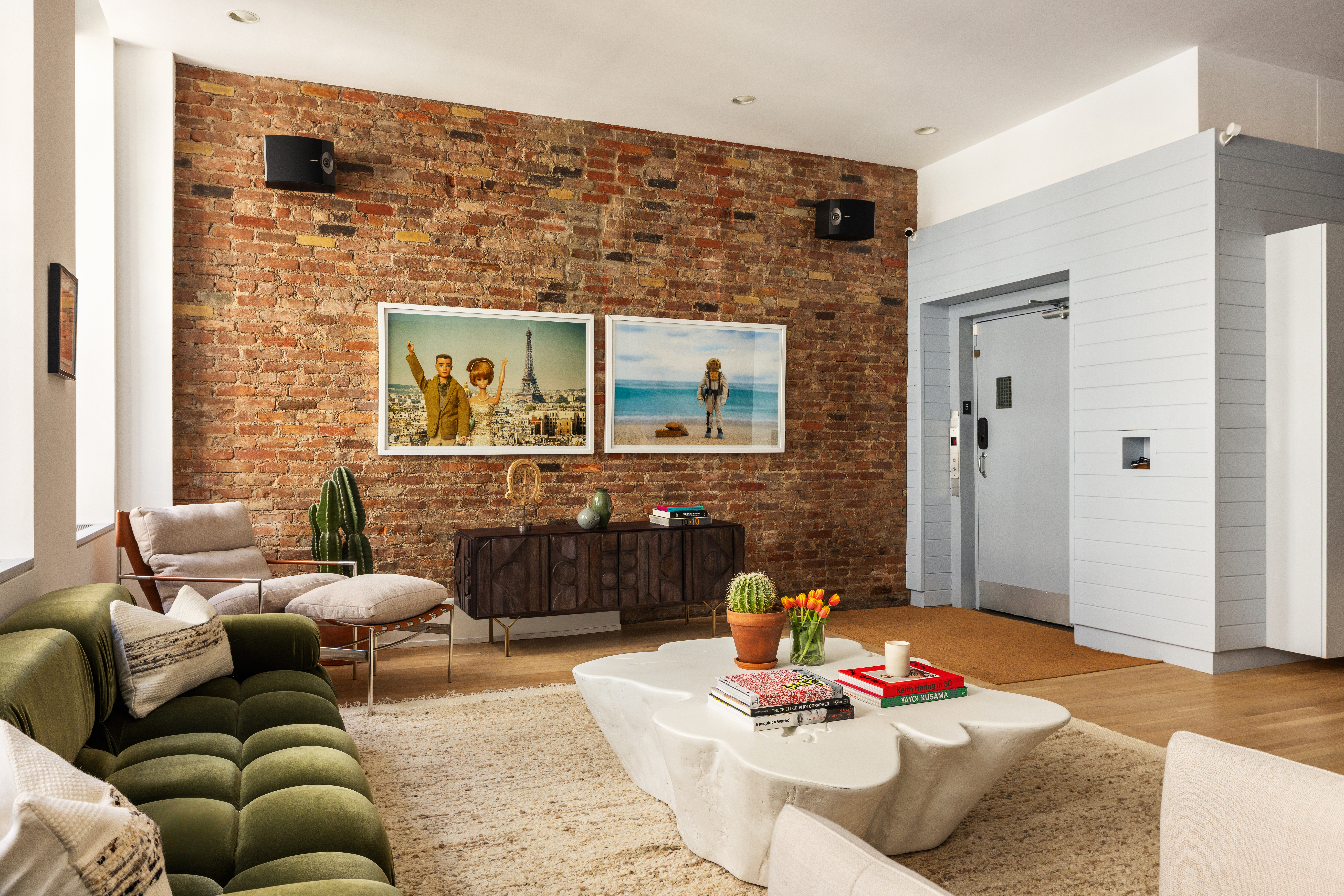 56 East 11th Street, Unit 5 Manhattan, NY 10003 - Photo 3 of 18 a living room with furniture and a fireplace