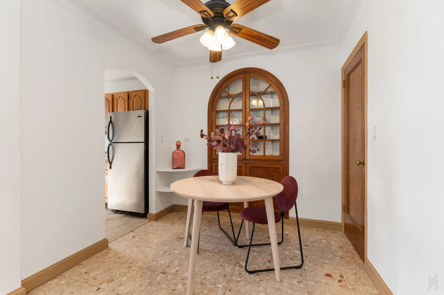 a view of a dining room with furniture and a chandelier