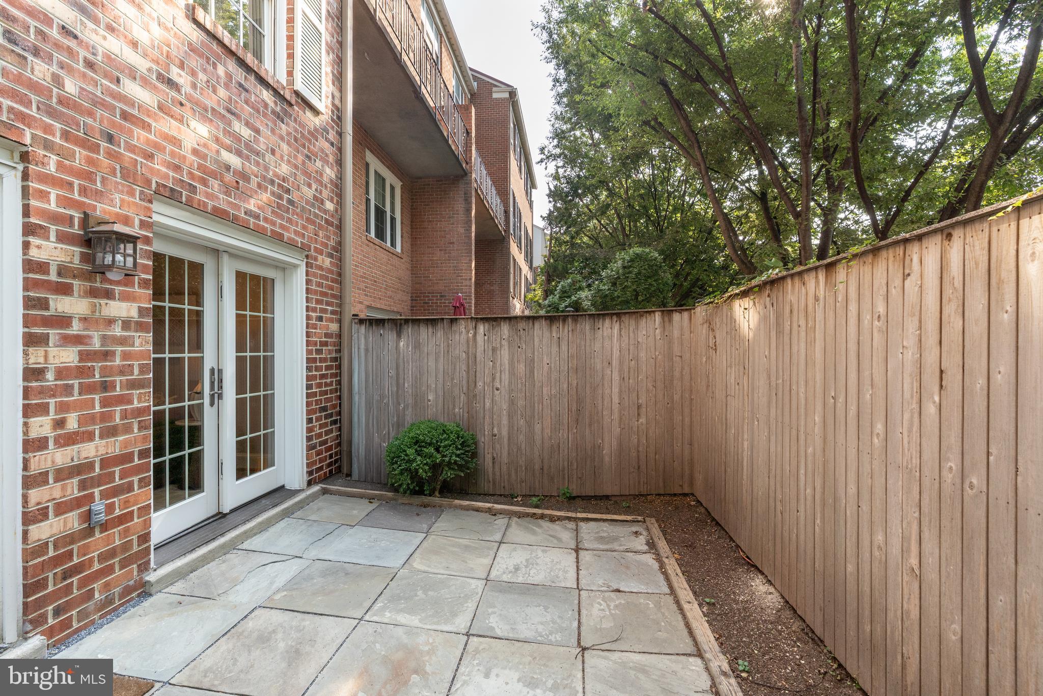 3299 Sutton Place Northwest, Unit C Washington, DC 20016 - Photo 10 of 41 a view of backyard with barbeque grill and plants