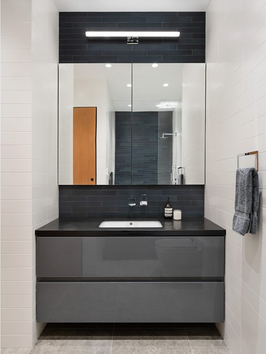 40 West 17th Street, Unit 9A Manhattan, NY 10011 - Photo 10 of 12 a bathroom with a sink and a mirror