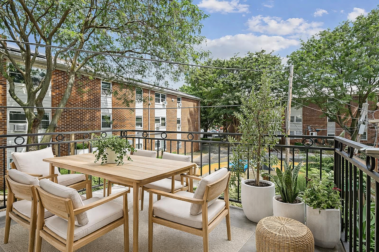 108 Eldert Street, Unit 2F Brooklyn, NY 11207 - Photo 7 of 8 a view of a patio with couches table and chairs and potted plants