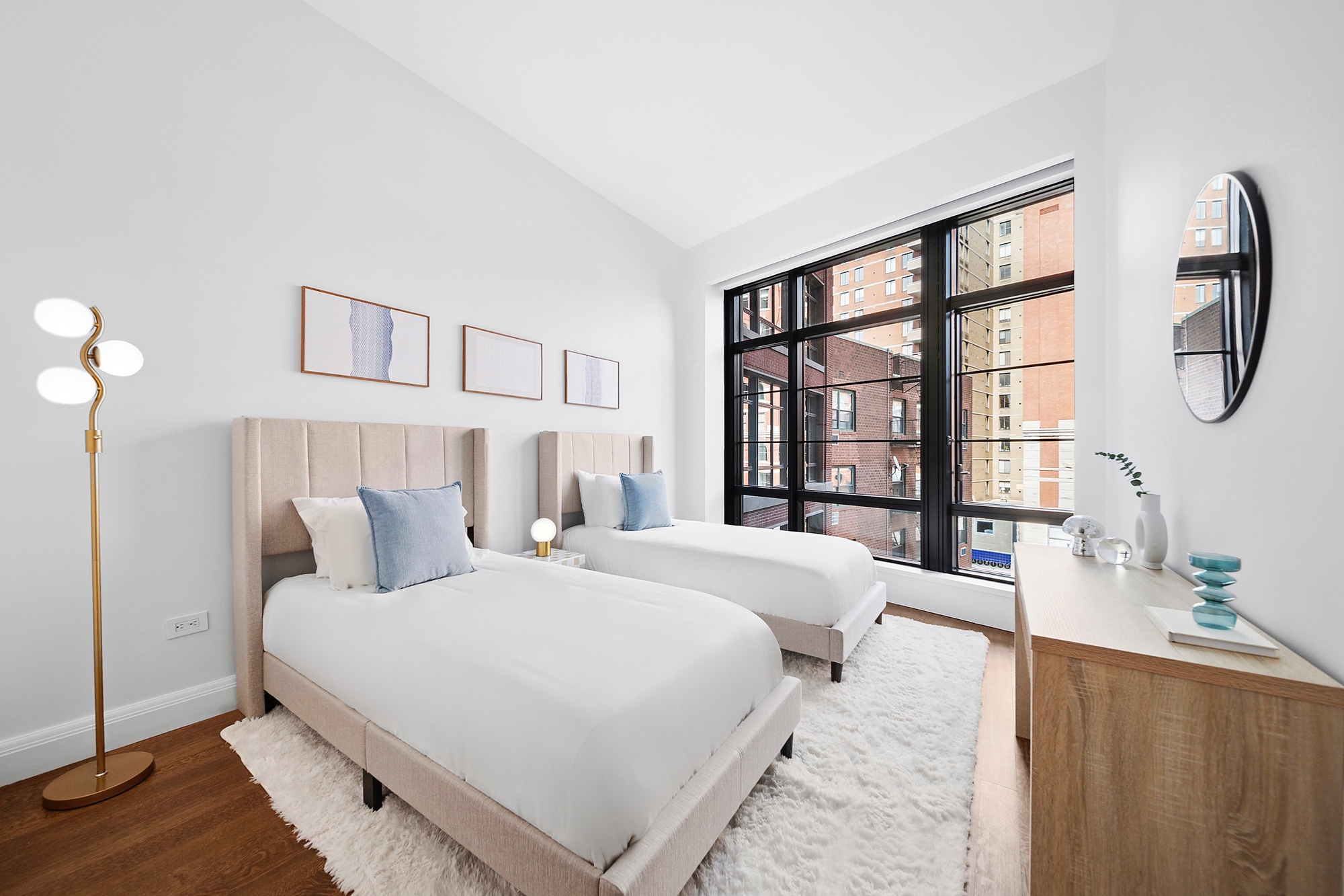 150 Charles Street, Unit 4AN Manhattan, NY 10014 - Photo 10 of 19 a bedroom with a large bed and a large window