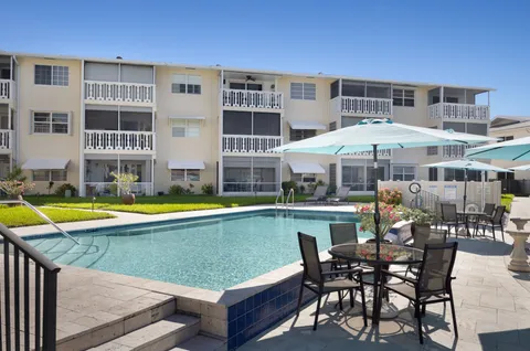 a view of swimming pool with outdoor seating