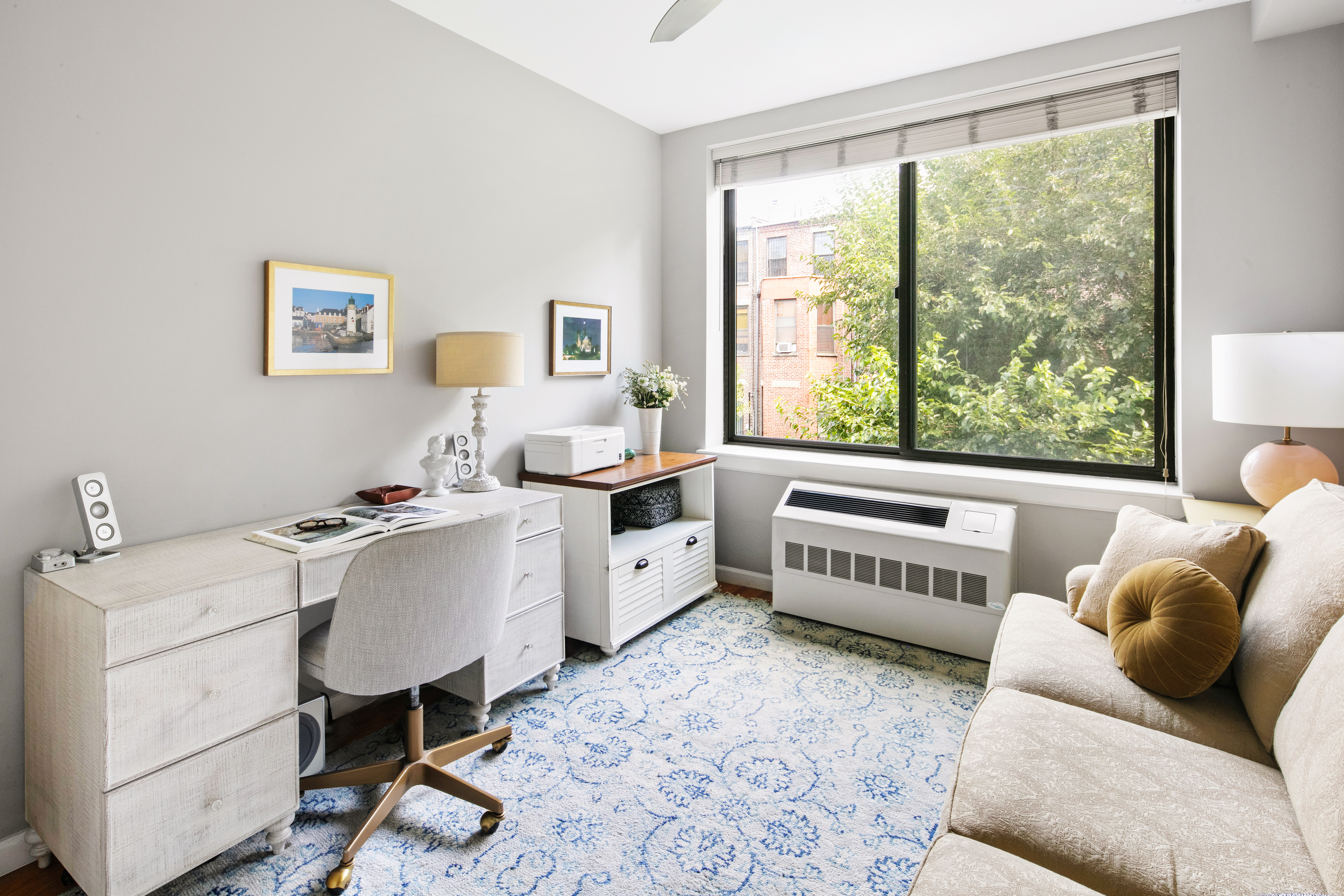 5 West 127th Street, Unit 3B Manhattan, NY 10027 - Photo 4 of 9 a living room with furniture and a large window