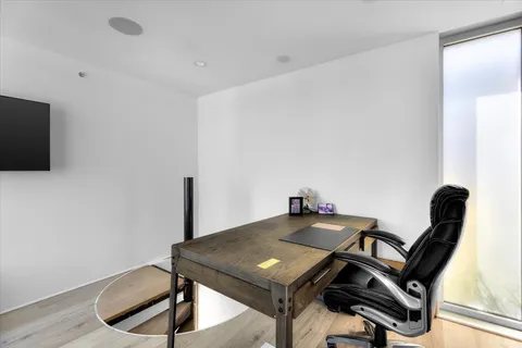 a view of a workspace with furniture