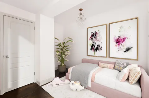 a bedroom with a bed and a painting on the wall