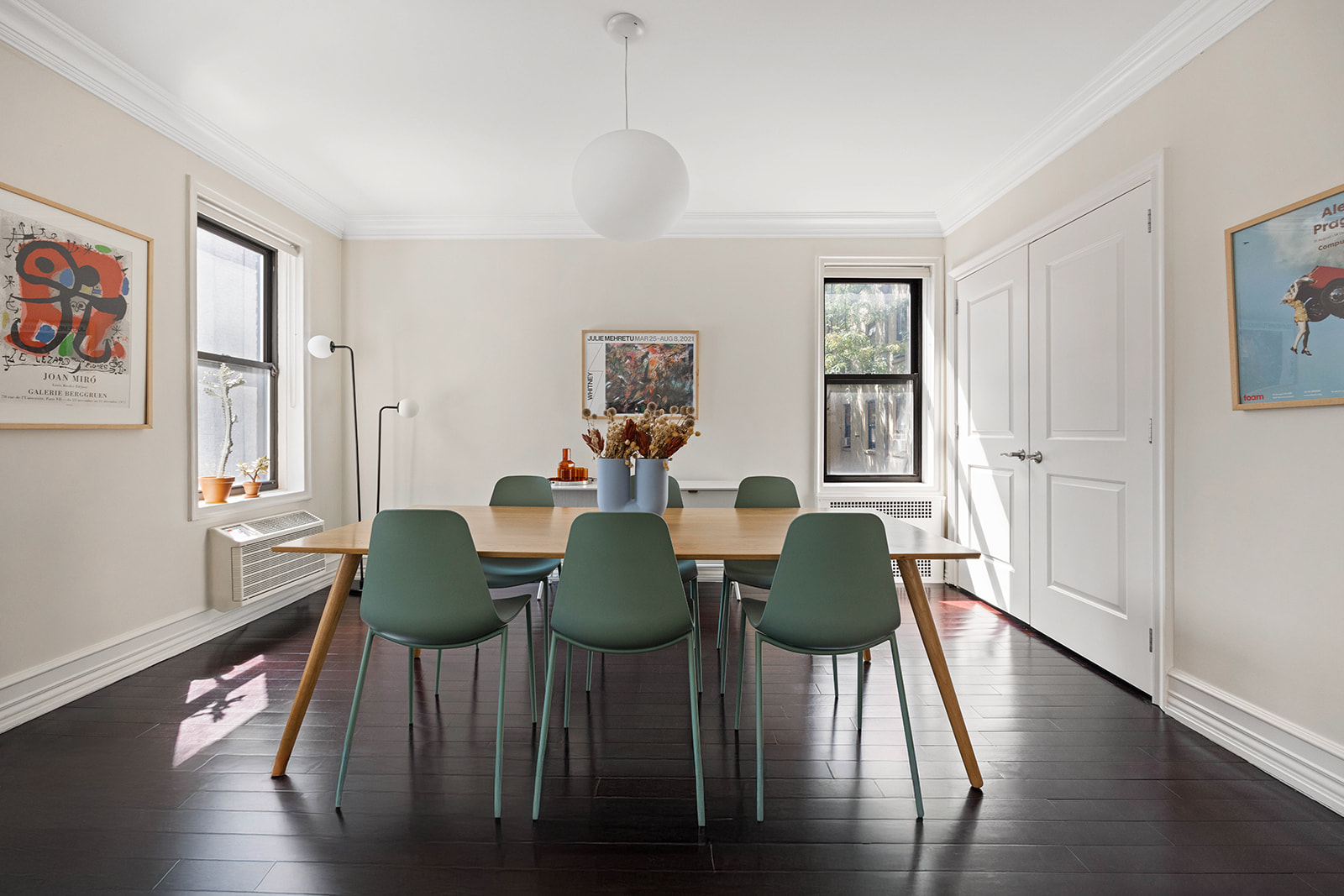 20 Clinton Street, Unit 4E Manhattan, NY 10002 - Photo 3 of 10 a view of a dining room with furniture and wooden floor