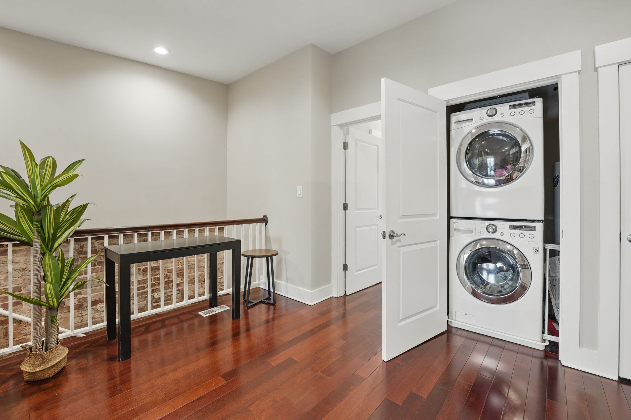 28 Q Street Northeast, Unit 2 Washington, DC 20002 - Photo 20 of 41 a hallway with wooden floor washer and dryer