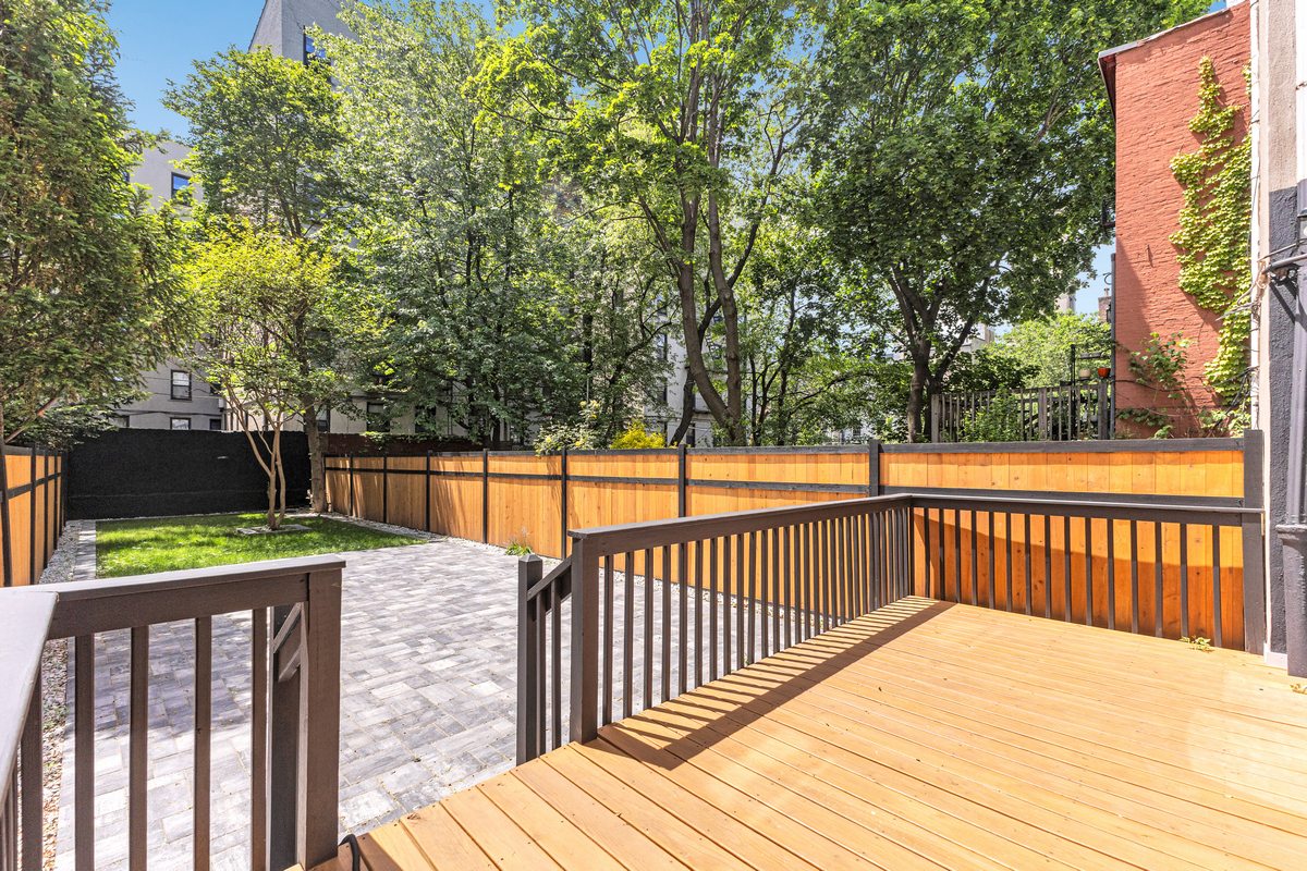 1050 Sterling Place Brooklyn, NY 11213 - Photo 14 of 23 a view of outdoor space with deck and trees