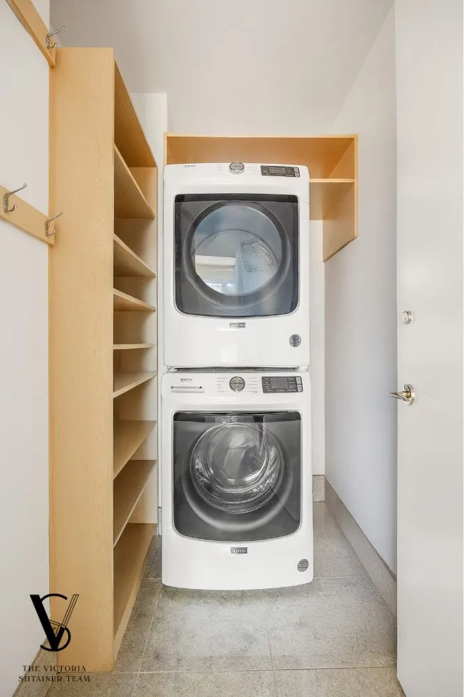 a utility room with washing machine and a washing machine