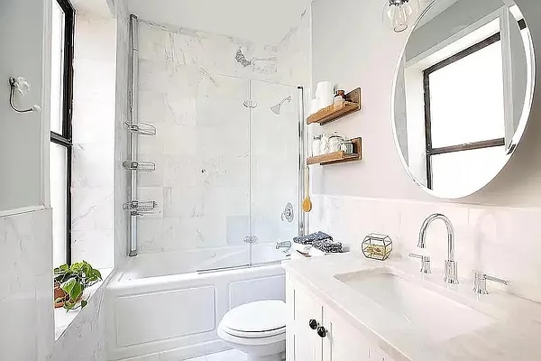 314 West 94th Street, Unit 5E Manhattan, NY 10025 - Photo 4 of 7 a bathroom with a sink a toilet and a bathtub