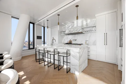 a living room with lots of furniture and decor