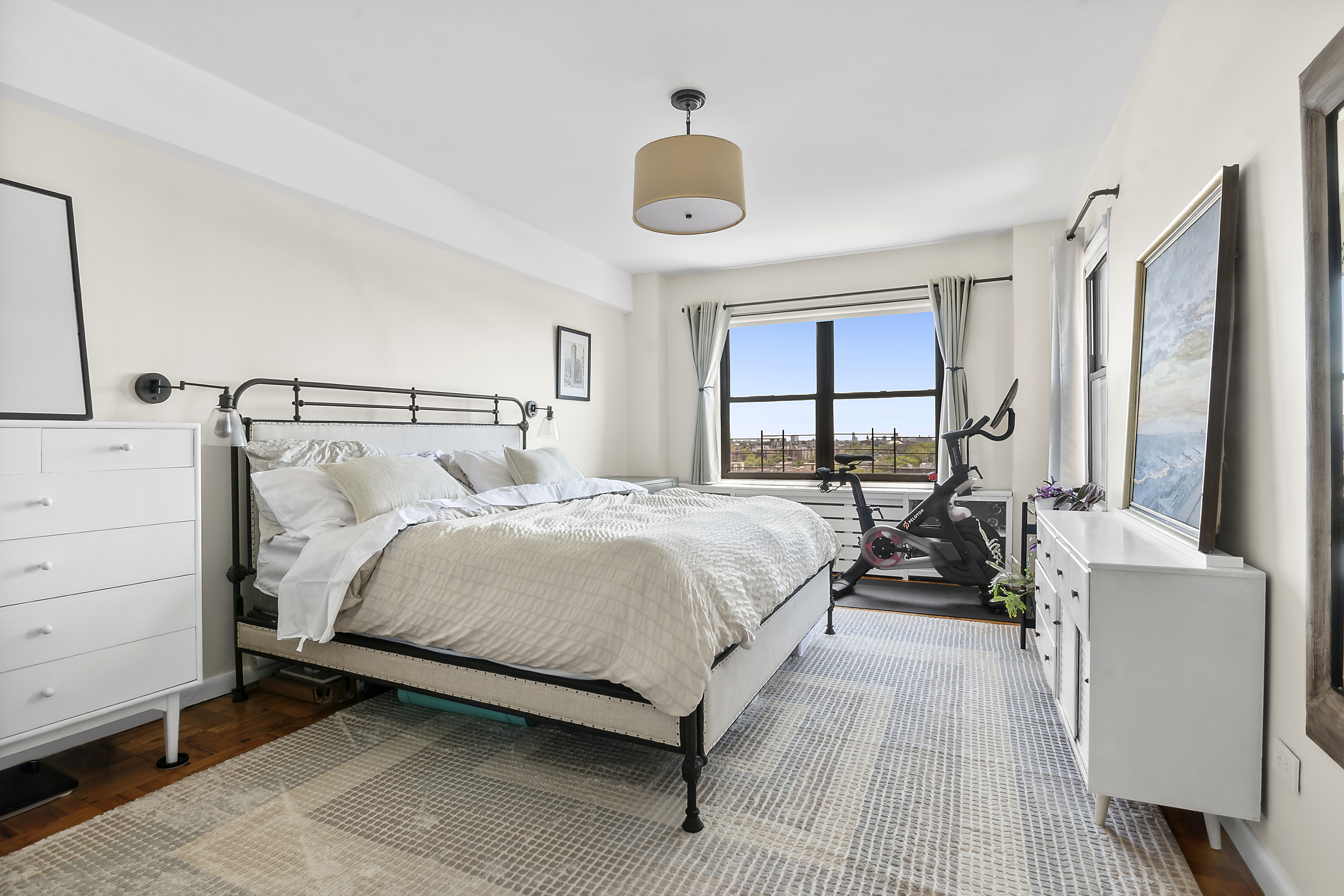 303 Beverley Road, Unit 10E Brooklyn, NY 11218 - Photo 7 of 11 a bedroom with a bed and a large window