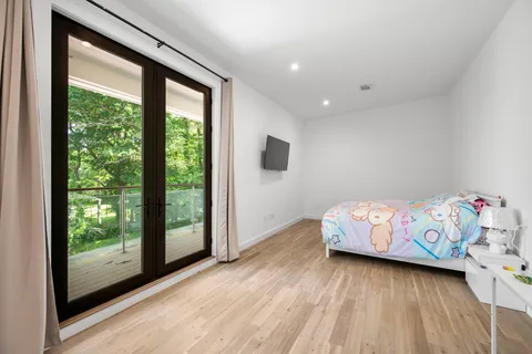 a bed room with a bed and a window