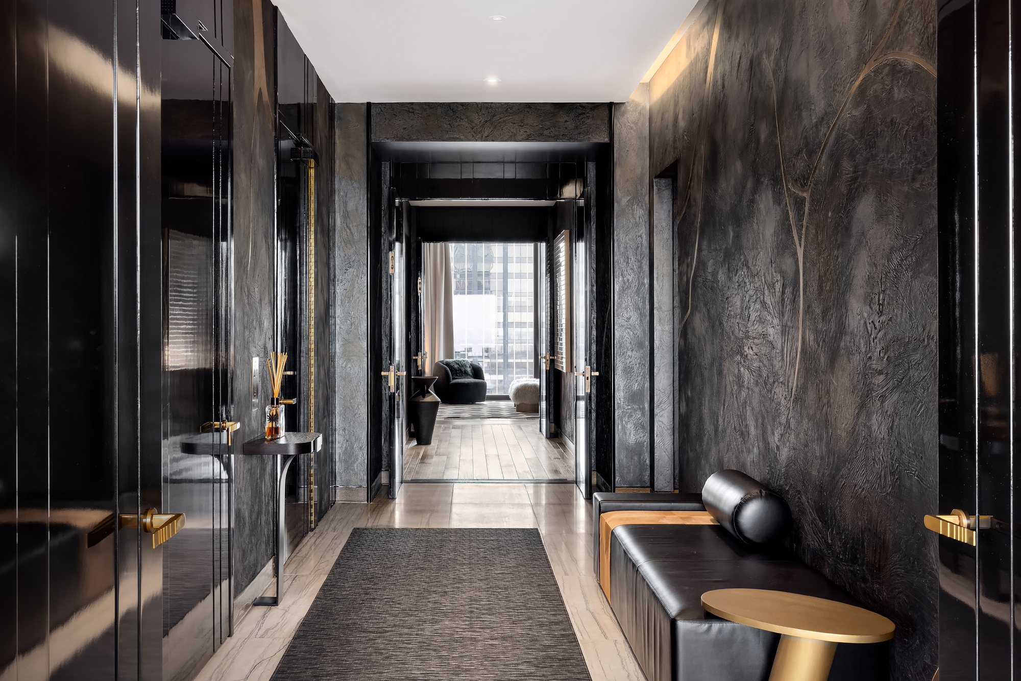 111 West 57th Street, Unit 46 Manhattan, NY 10019 - Photo 5 of 14 a hallway with furniture and view of living room