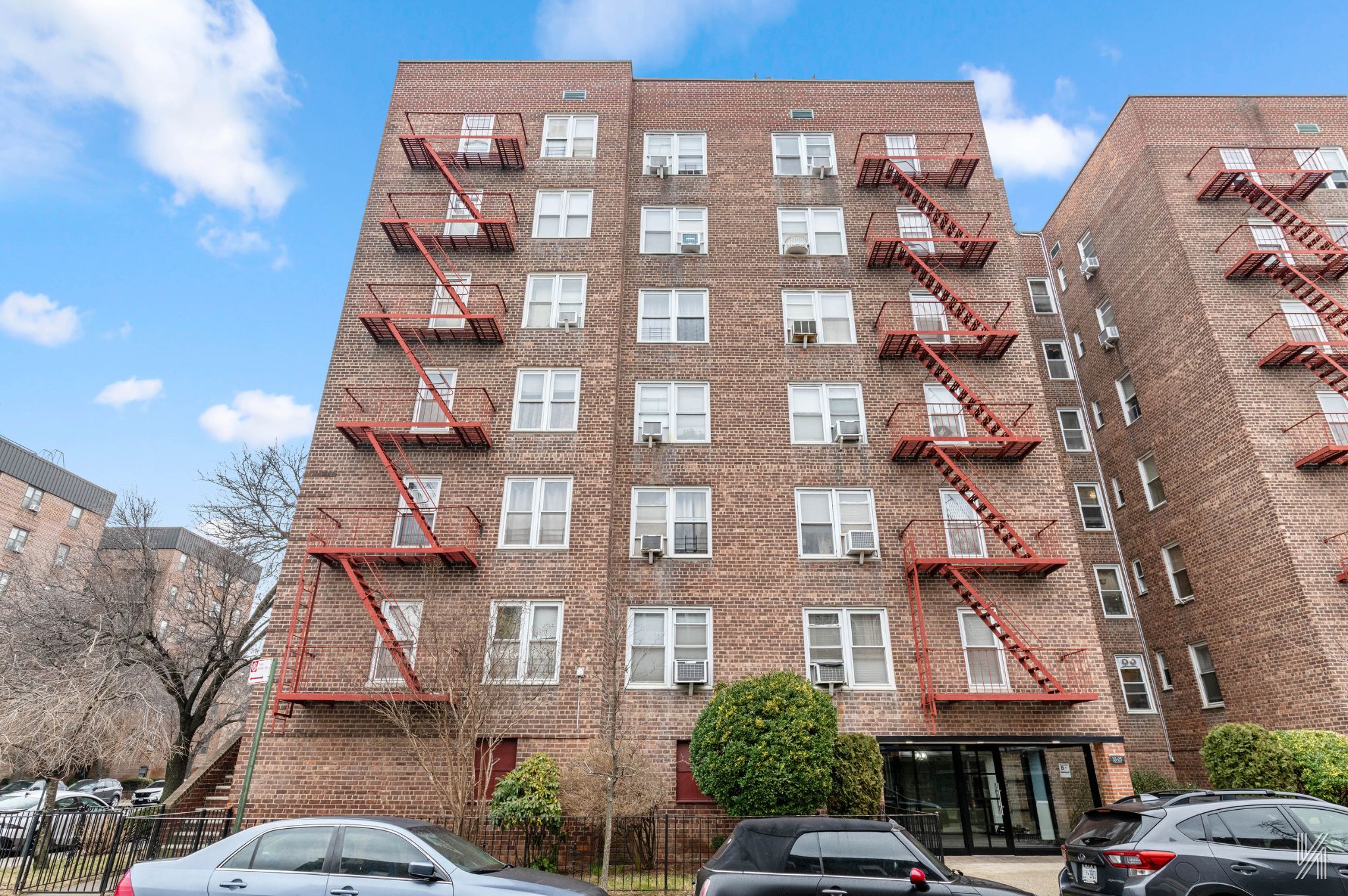 33-05 90th Street, Unit 4F Queens, NY 11372 - Photo 1 of 18 a front view of a multi story building