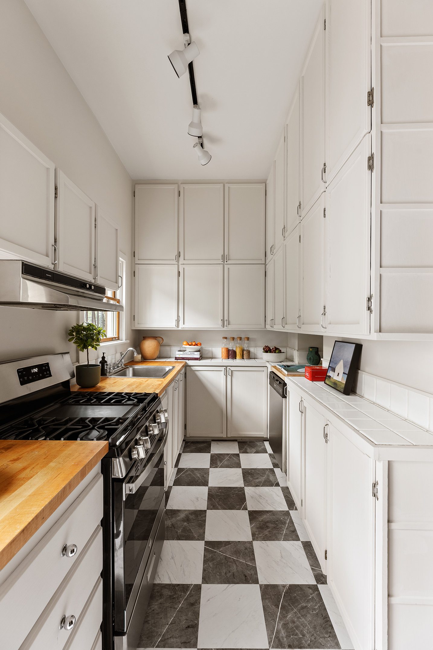 115 A 2nd Place Brooklyn, NY 11231 - Photo 7 of 27 a large white kitchen with a stove a sink and a refrigerator
