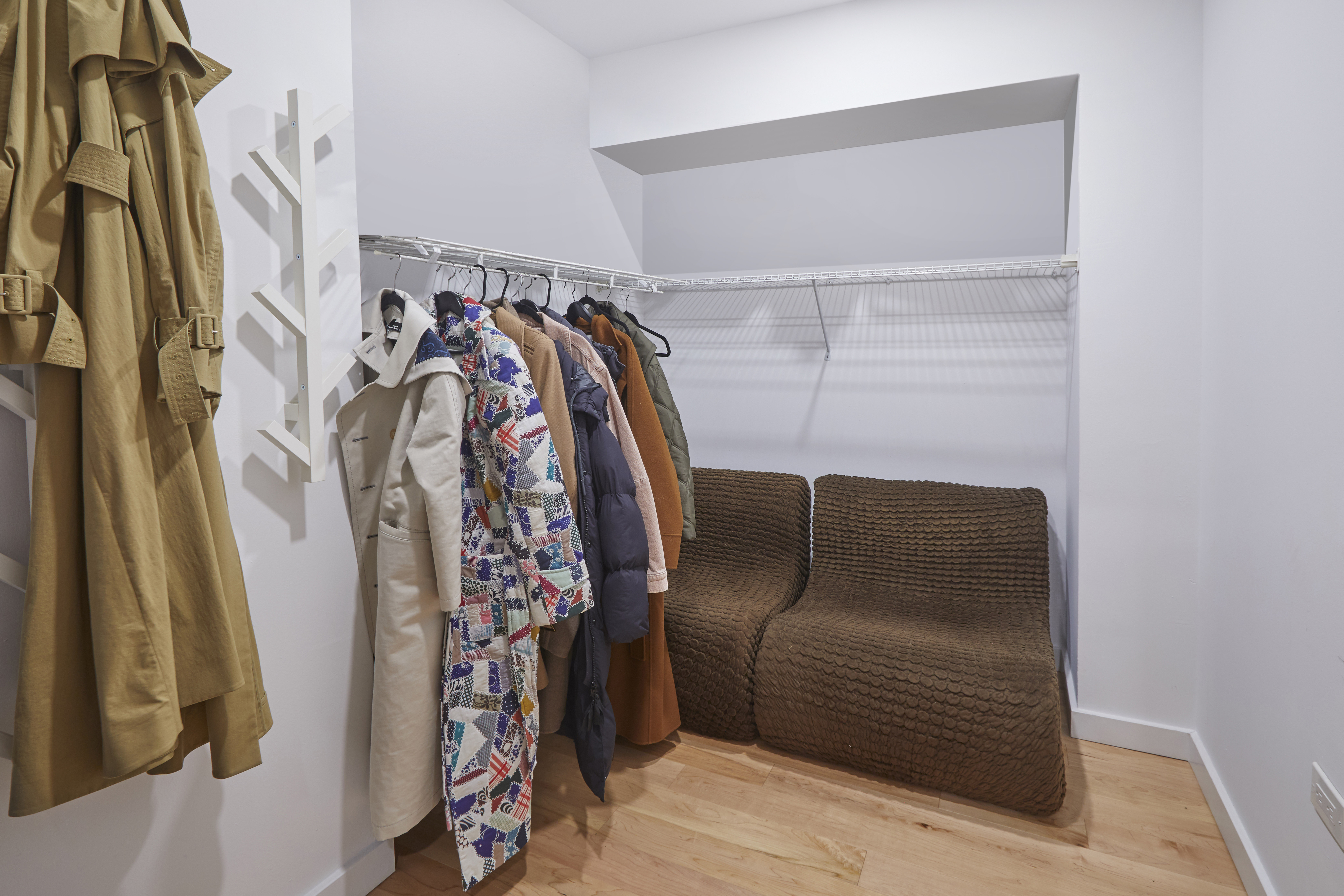 150 West 51st Street, Unit 1528 Manhattan, NY 10019 - Photo 4 of 21 a view of walk in closet with clothes and shoes