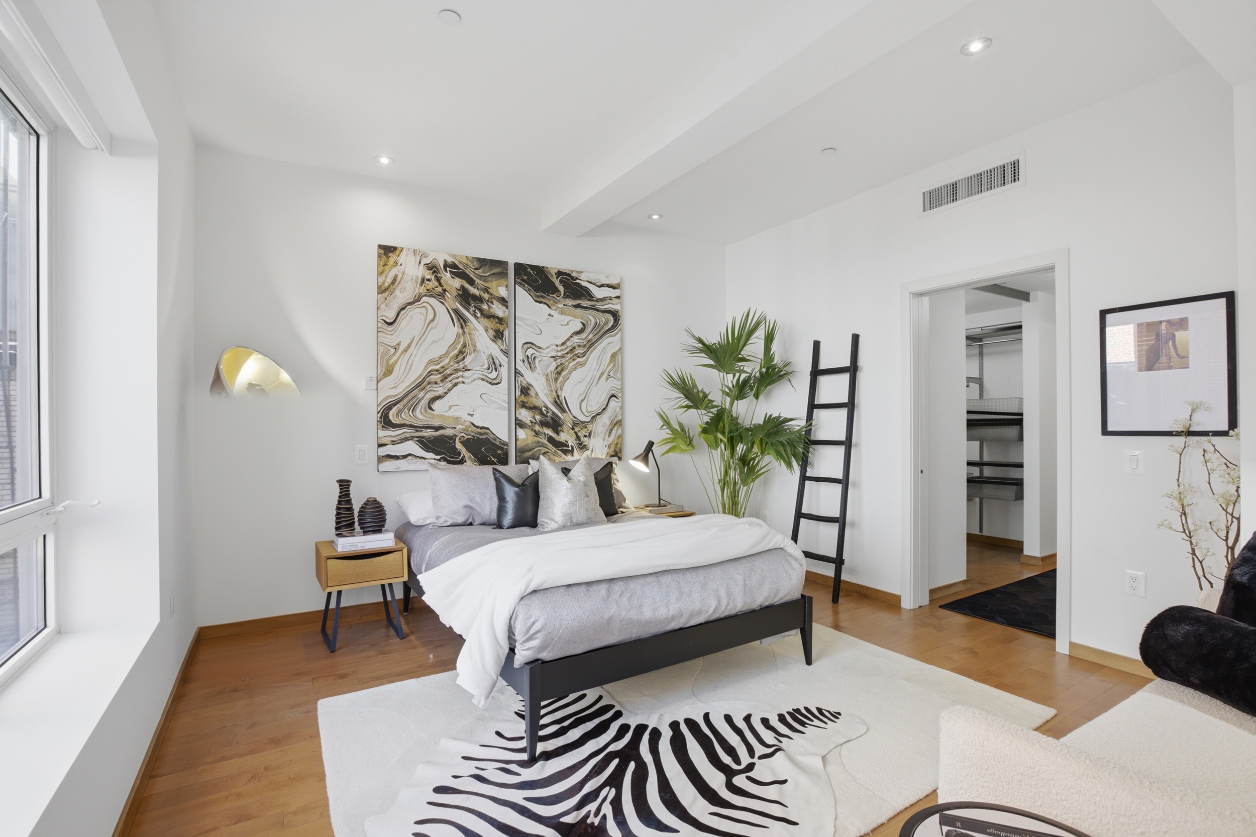 135 West 4th Street, Unit 2W Manhattan, NY 10012 - Photo 13 of 20 a bedroom with a bed and a couch