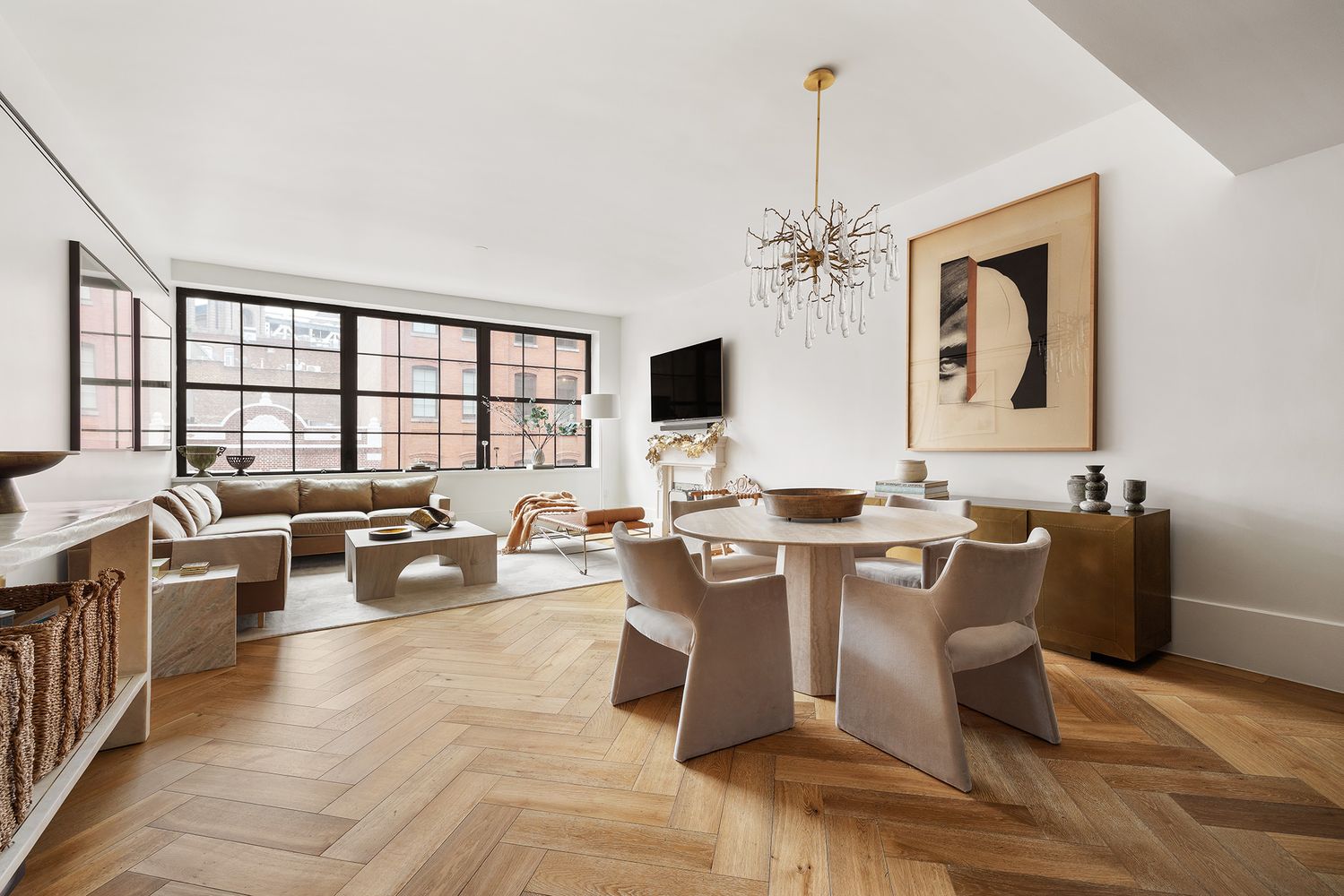 a living room with lots of furniture and chandelier