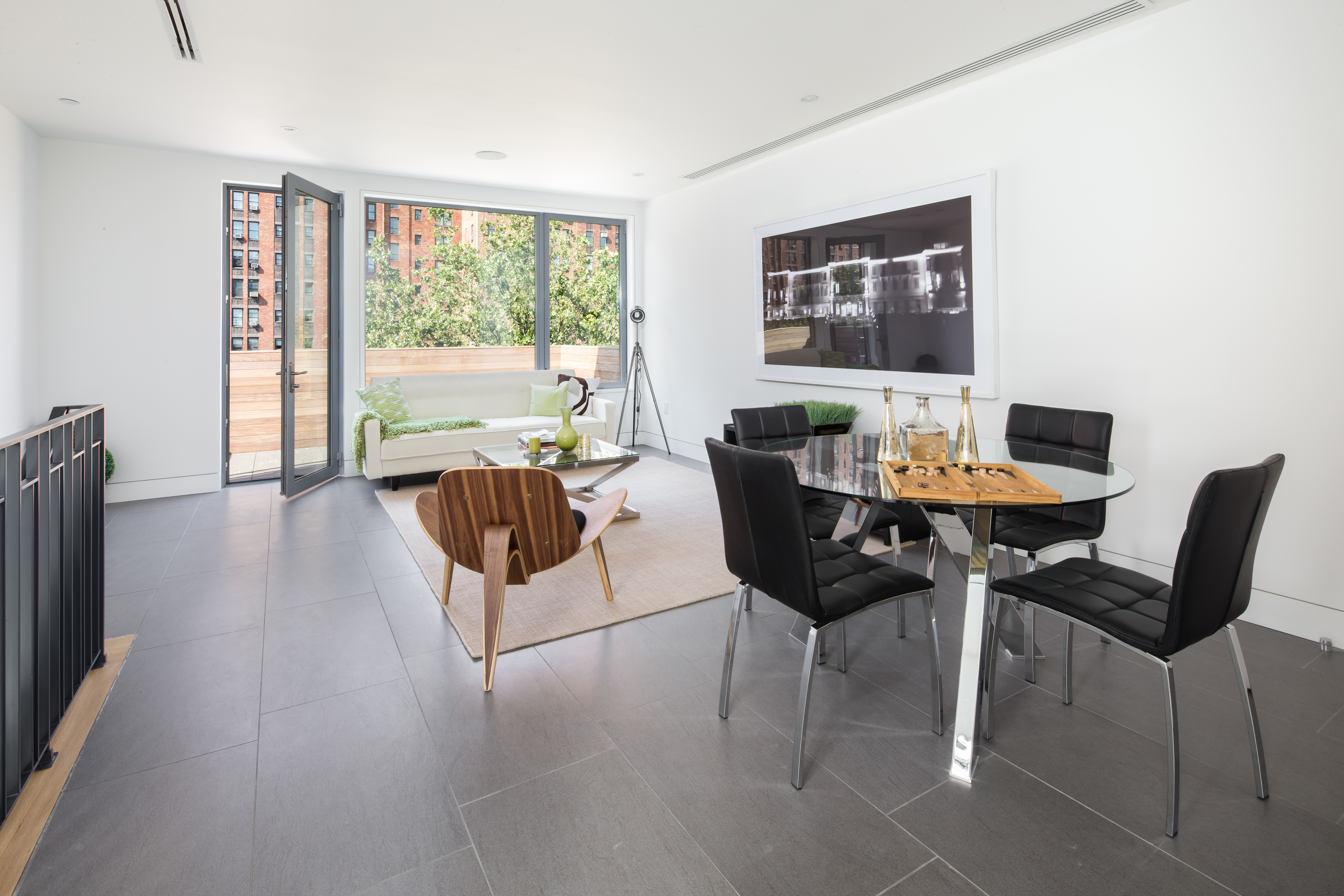 450 West 25th Street Manhattan, NY 10001 - Photo 13 of 16 a living room with furniture and a large window