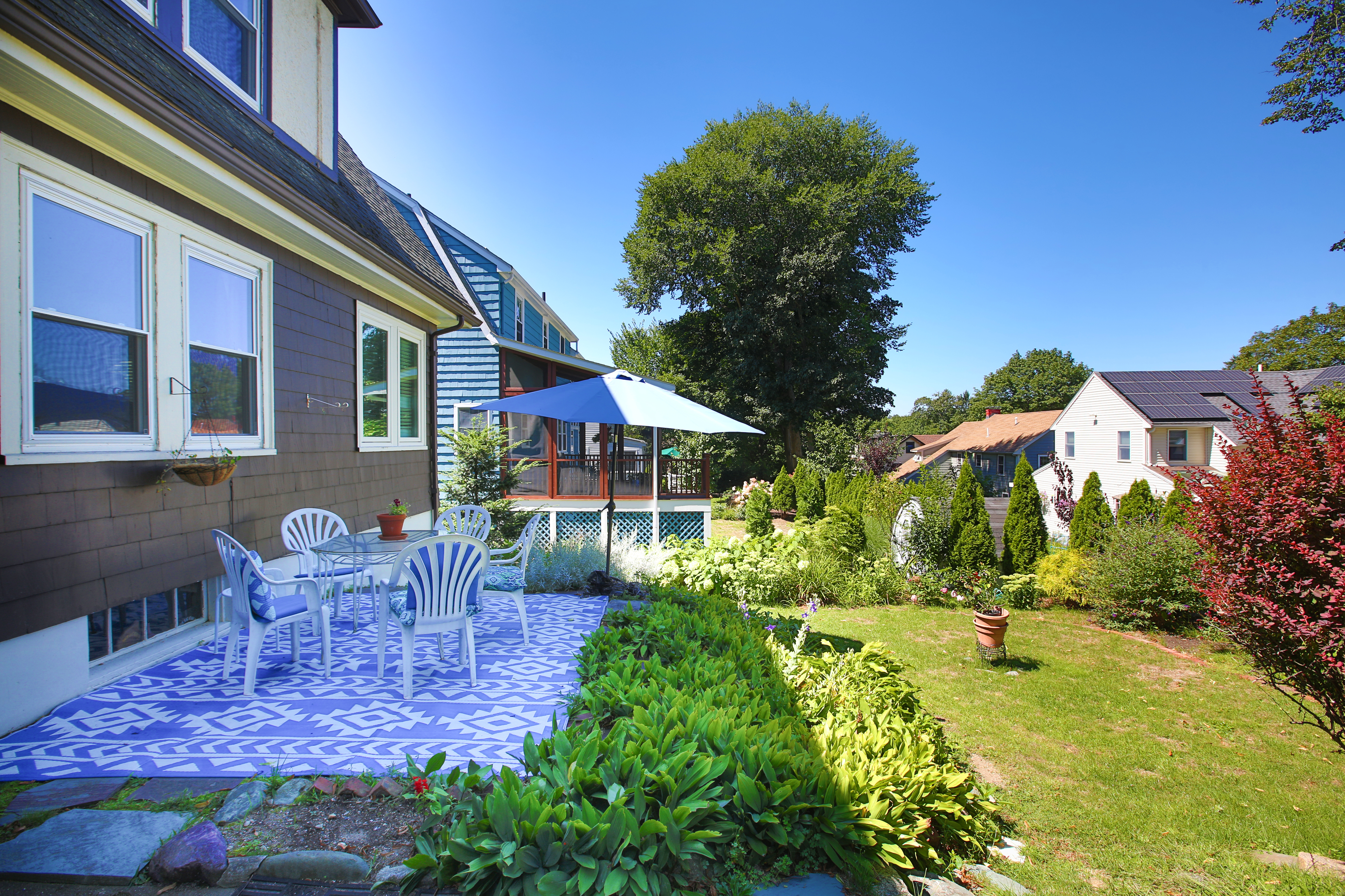147 Oliver Road Waban, MA 02468 - Photo 4 of 6 a view of a house with backyard porch and sitting area