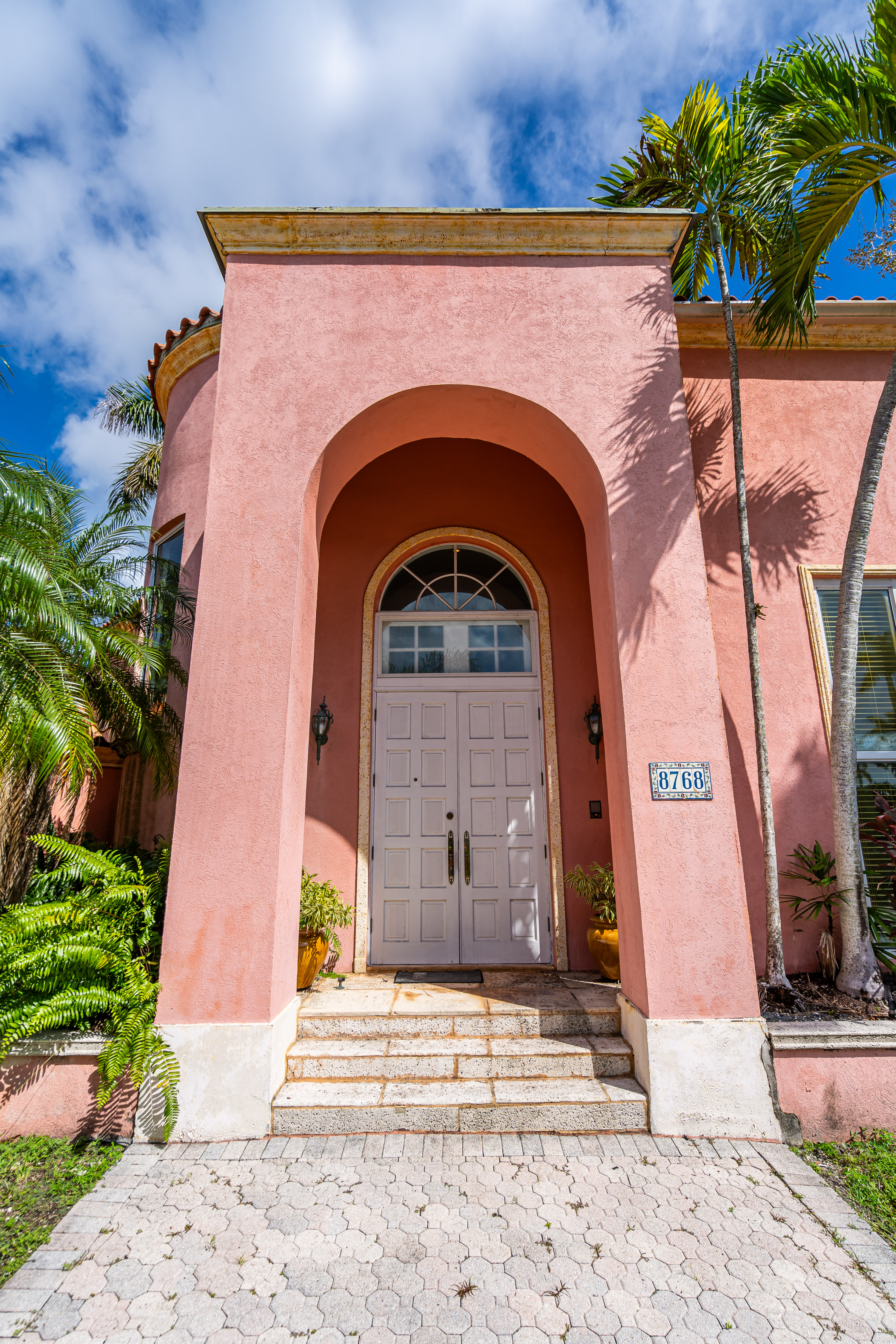 8768 Southwest 62nd Court Miami, FL 33156 - Photo 4 of 56 a front view of a house with a garden