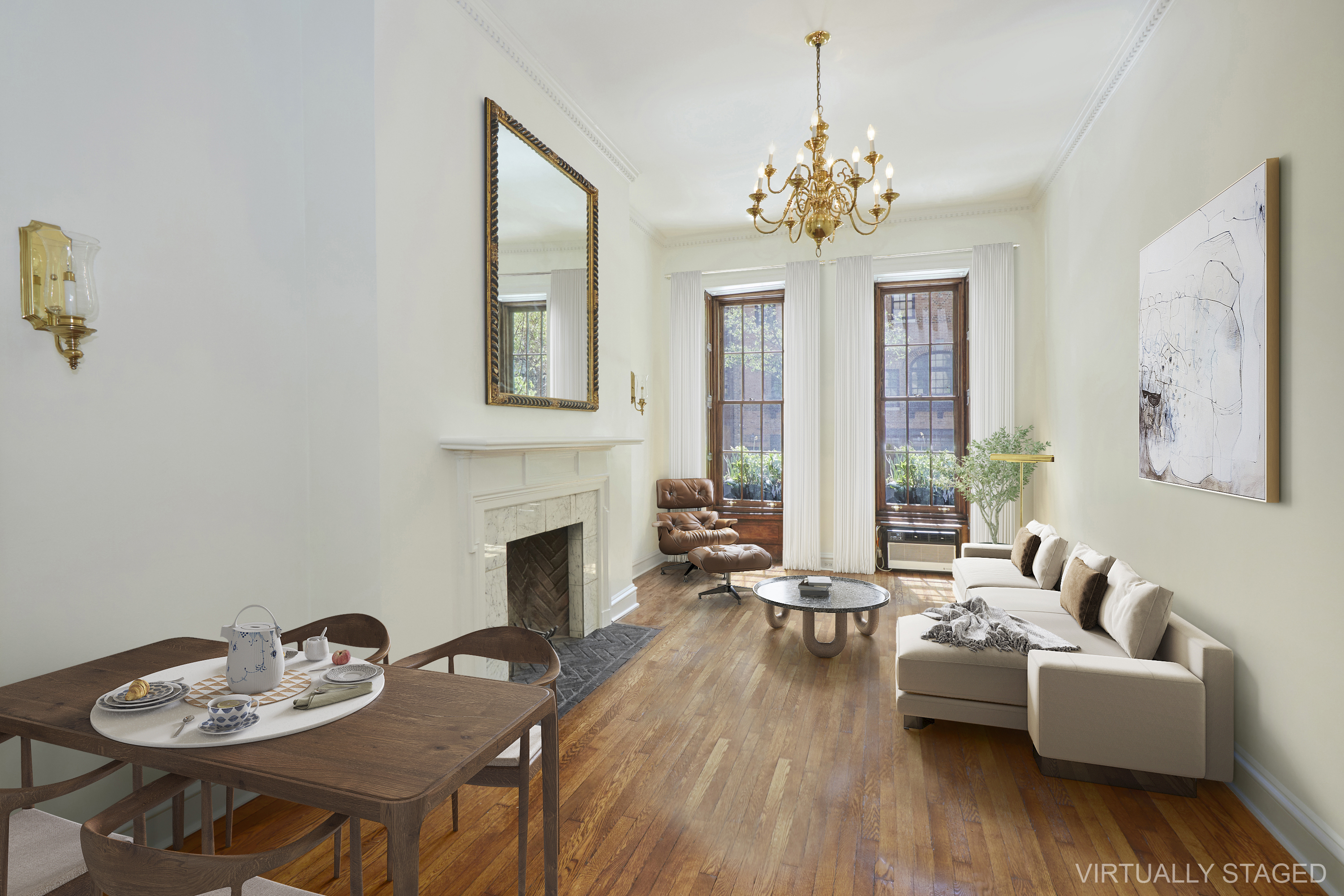 a living room with fireplace furniture and a chandelier