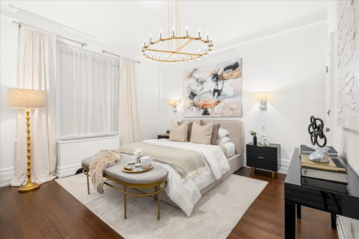 a bedroom with a bed and a table