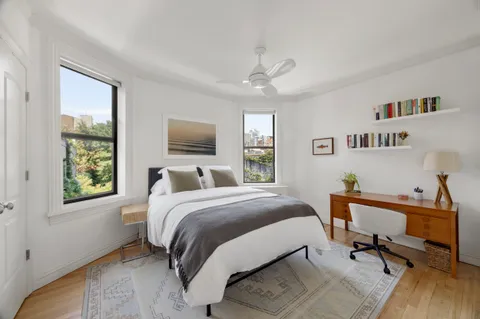 a bed room with a bed and a window