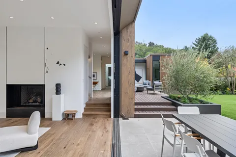 a view of a living room and a balcony