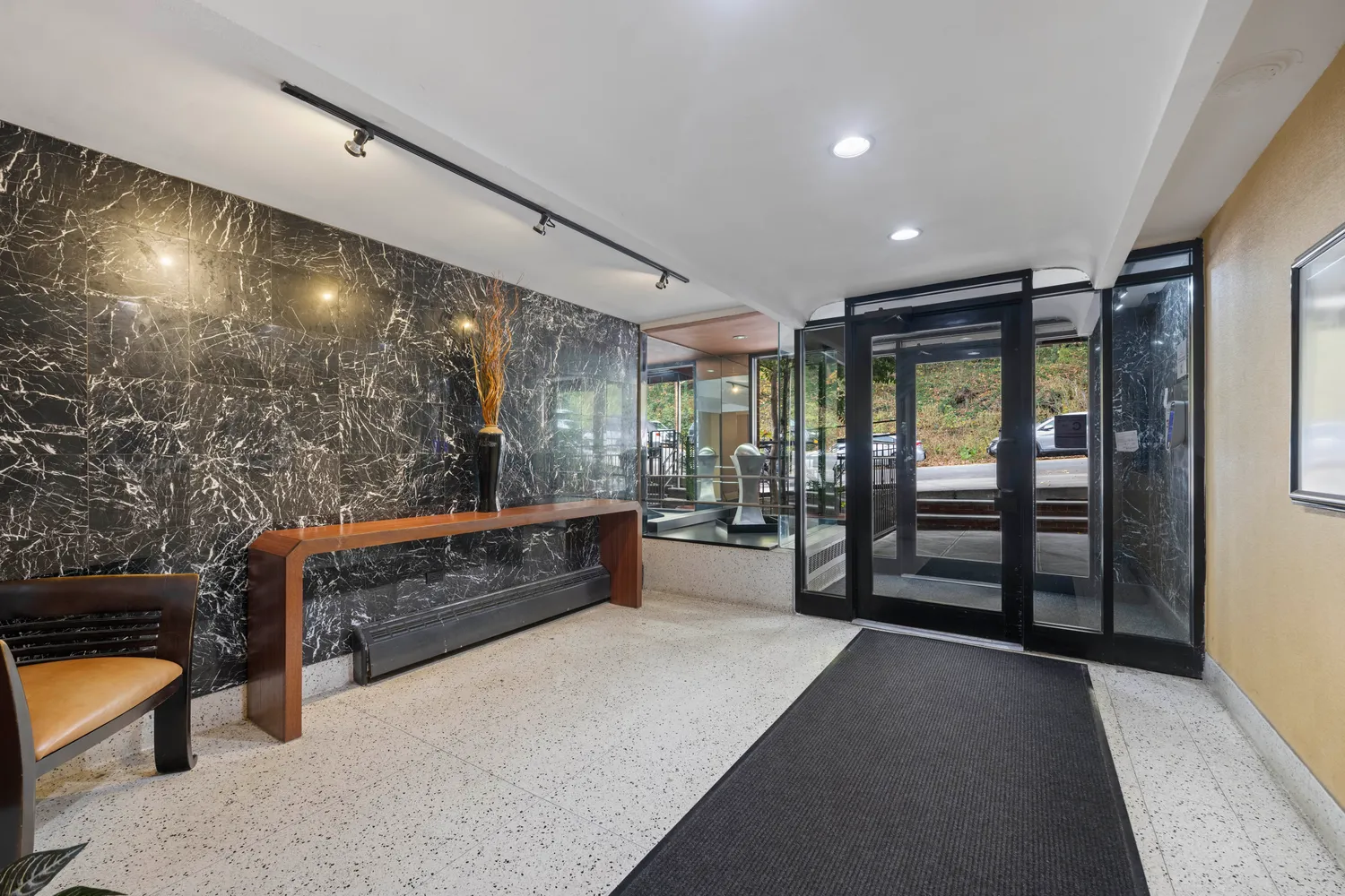 a large room with lots of wooden furniture and a large window