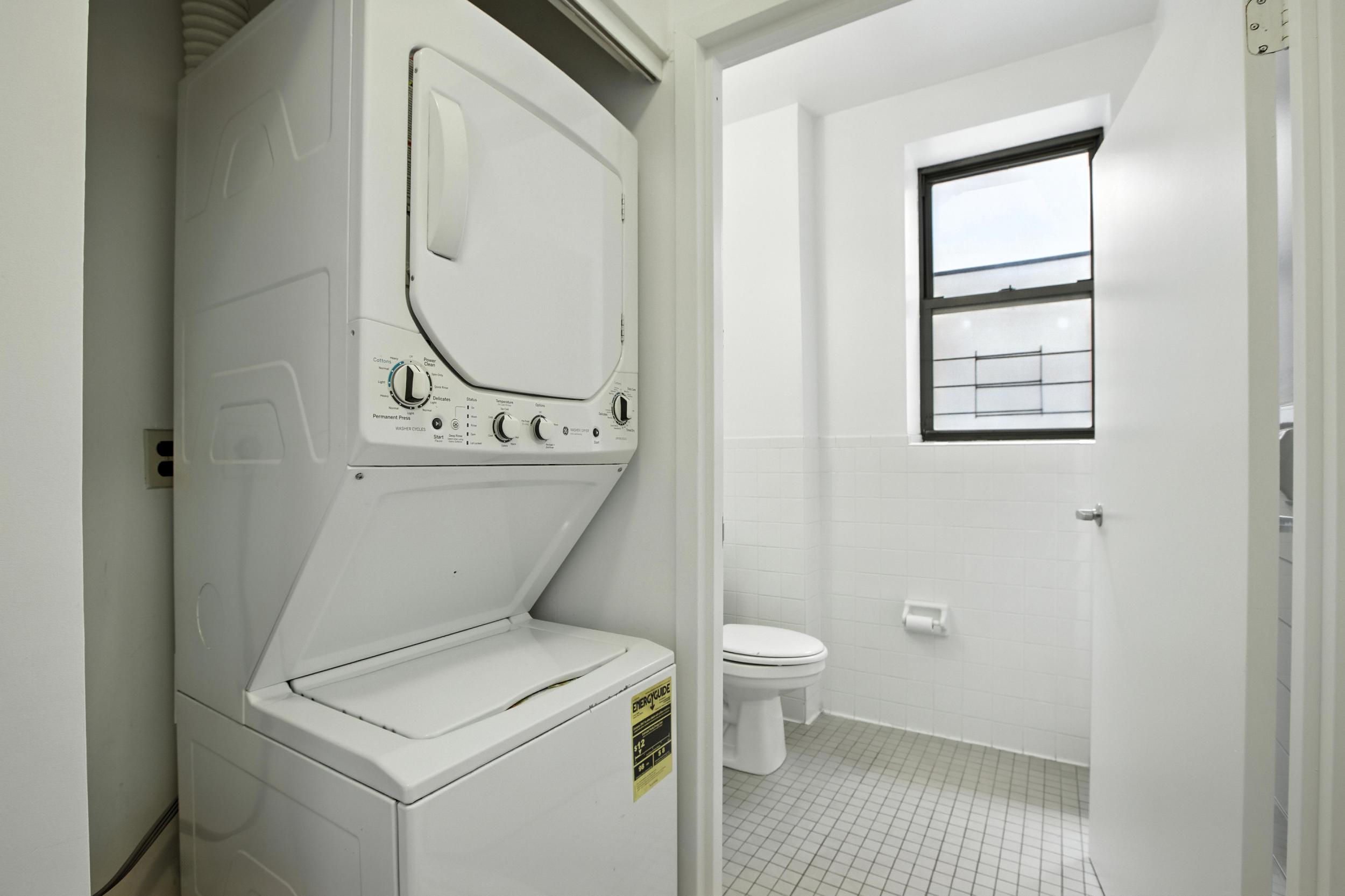2611 Frederick Douglass Boulevard, Unit 4A Manhattan, NY 10030 - Photo 7 of 10 a bathroom with a toilet sink and a mirror