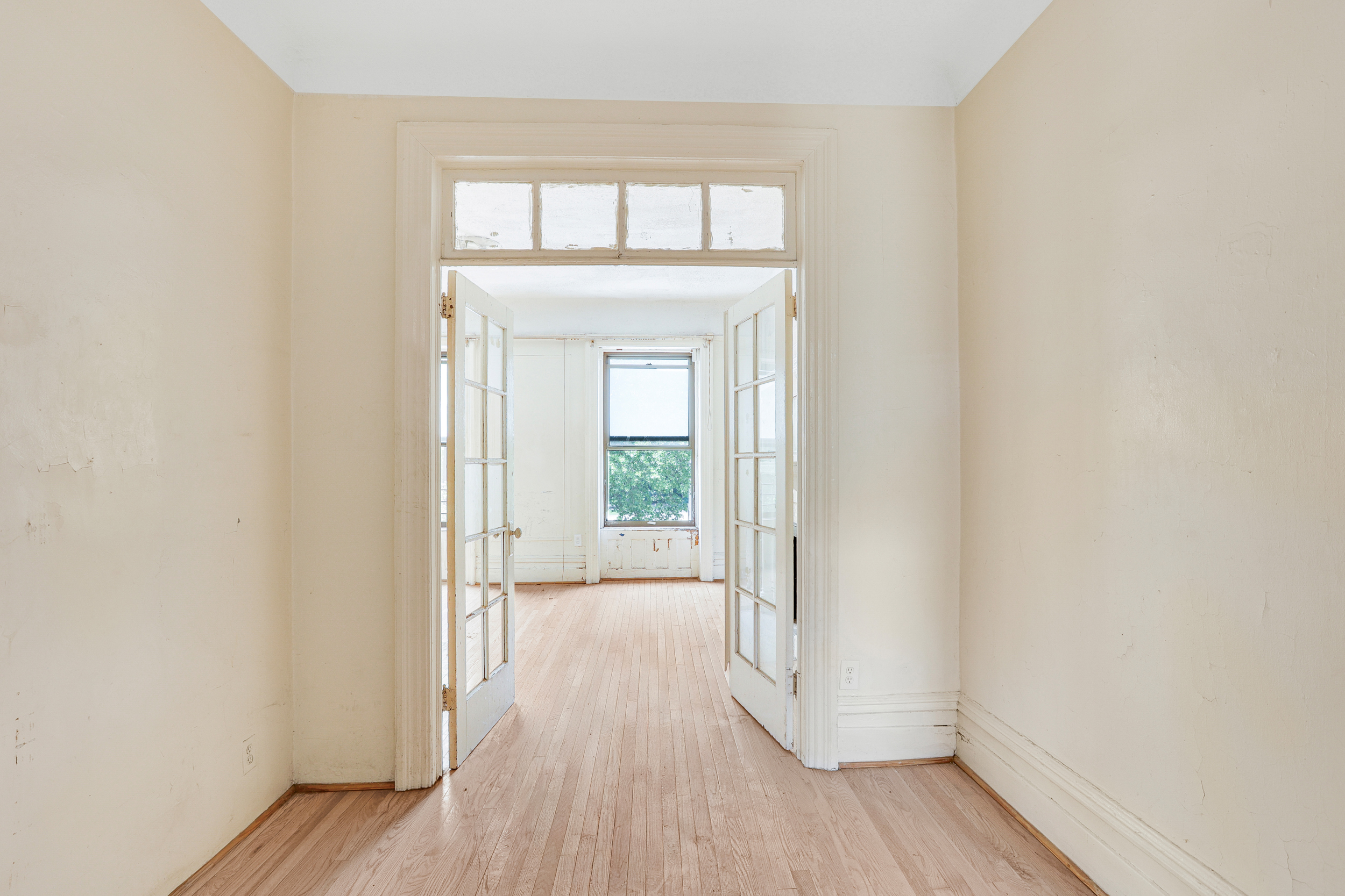 282 Manhattan Avenue, Unit 3N Manhattan, NY 10026 - Photo 10 of 17 wooden floor in an empty room
