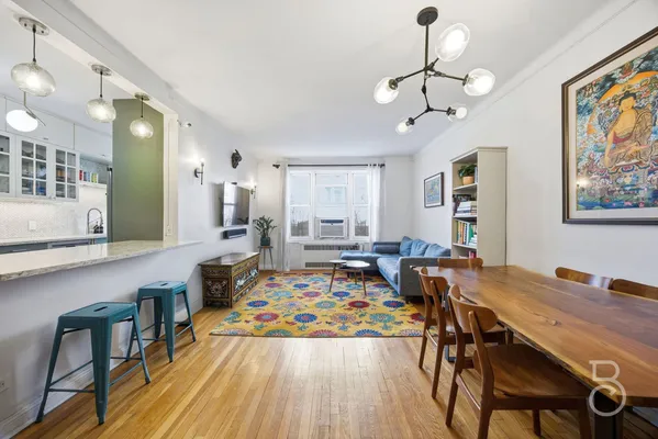a very nice looking dining room with a table and chairs