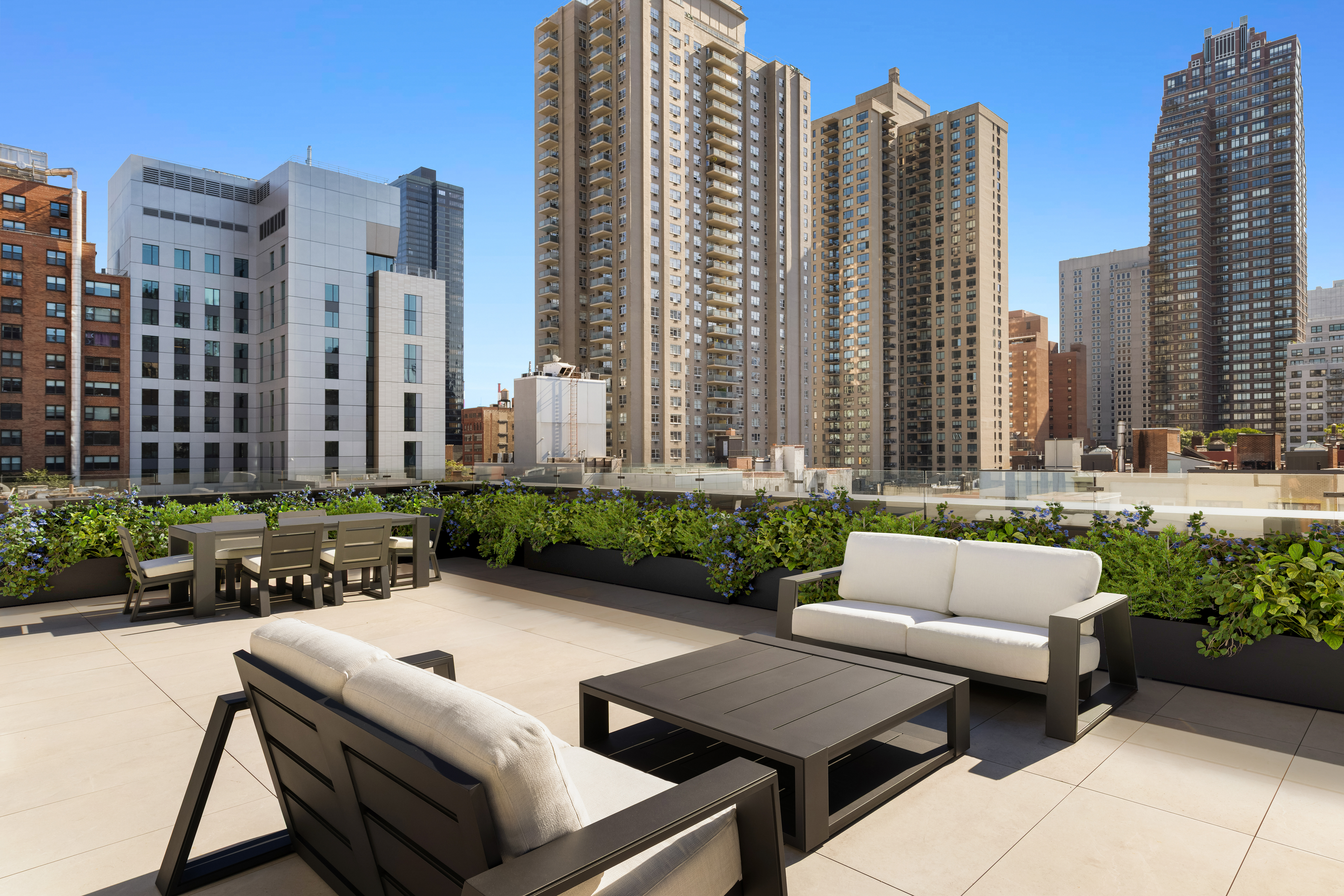 420 East 75th Street, Unit 2 Manhattan, NY 10021 - Photo 22 of 25 a view of a patio with couches and a fire pit and furniture