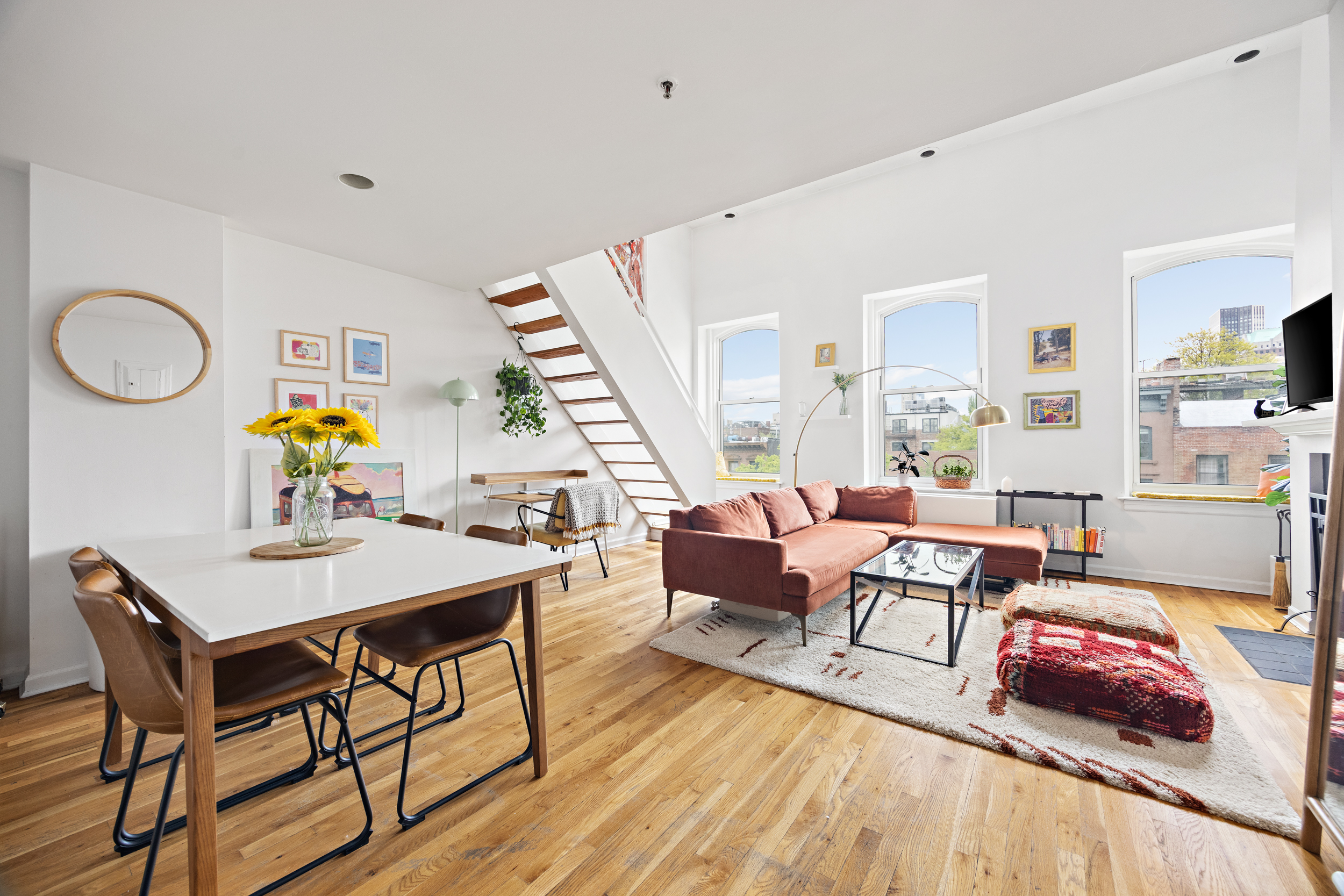 124 Atlantic Avenue, Unit A4H Brooklyn, NY 11201 - Photo 8 of 19 a living room with furniture and a wooden floor