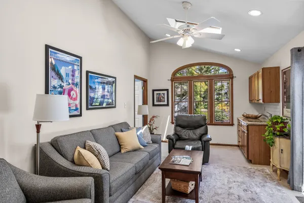 a view of a livingroom with furniture and a potted plant
