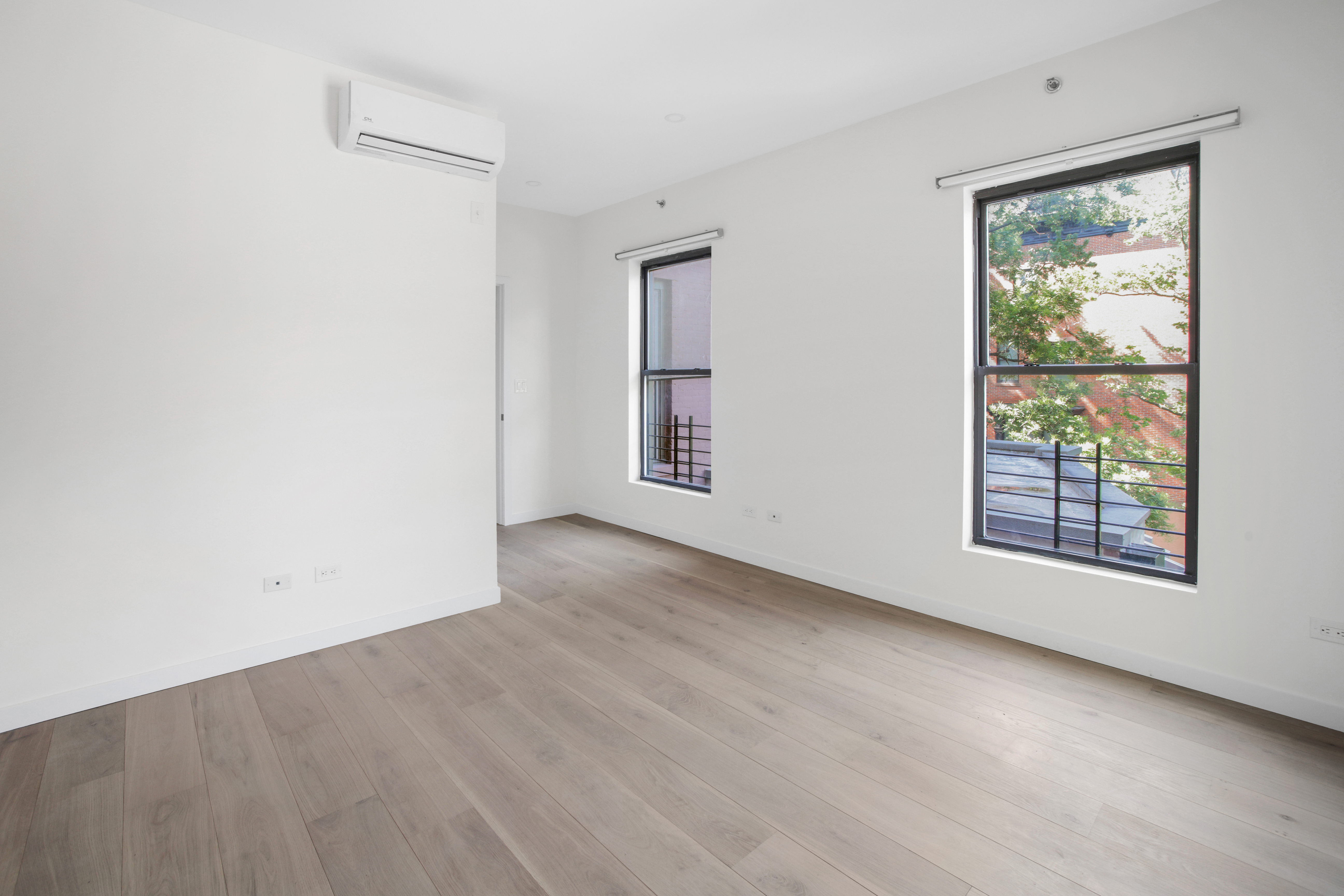 94 6th Avenue, Unit 3R Brooklyn, NY 11217 - Photo 4 of 12 an empty room with windows and closet
