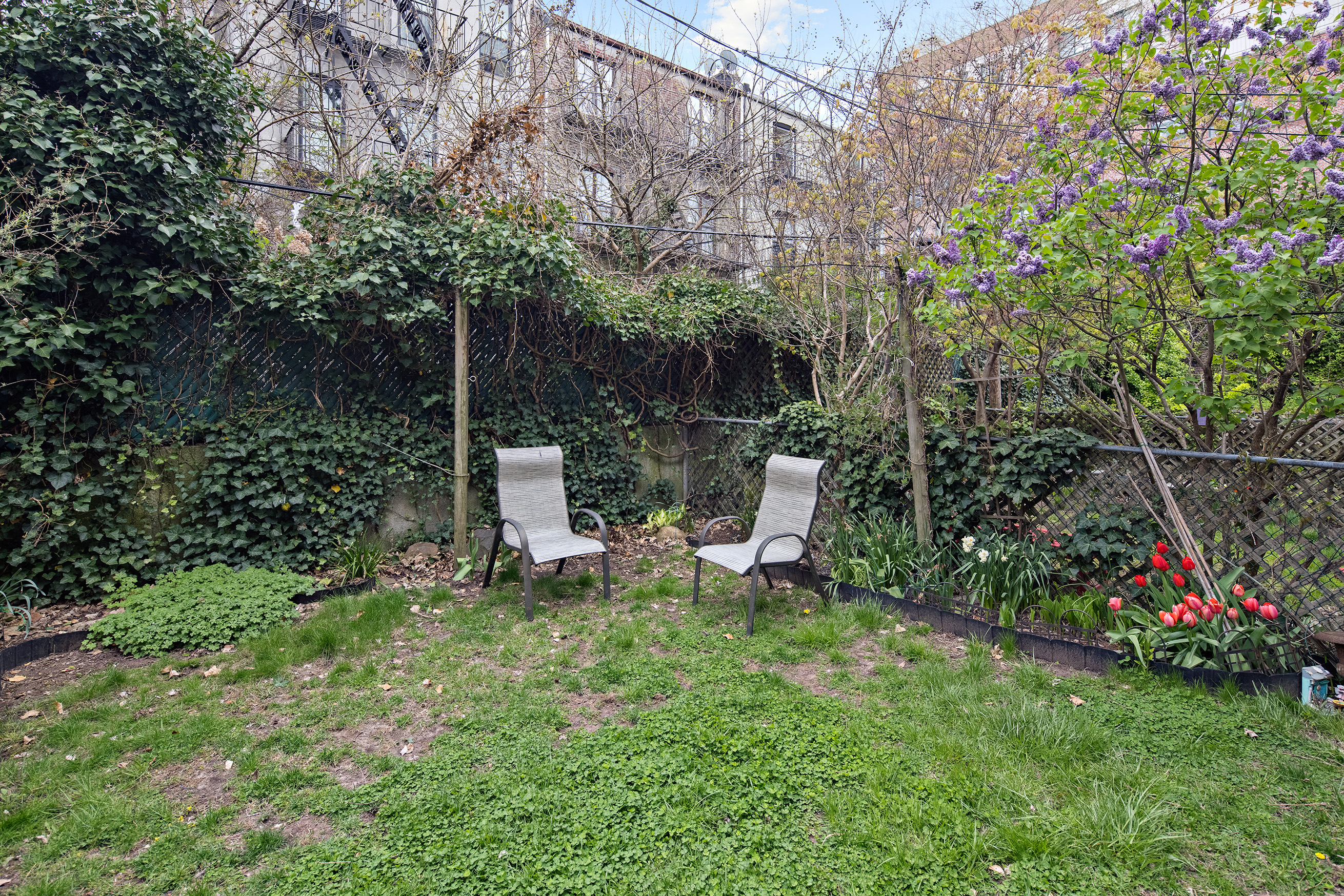 454 12th Street, Unit 3 Brooklyn, NY 11215 - Photo 12 of 18 a view of a chair and table in the garden