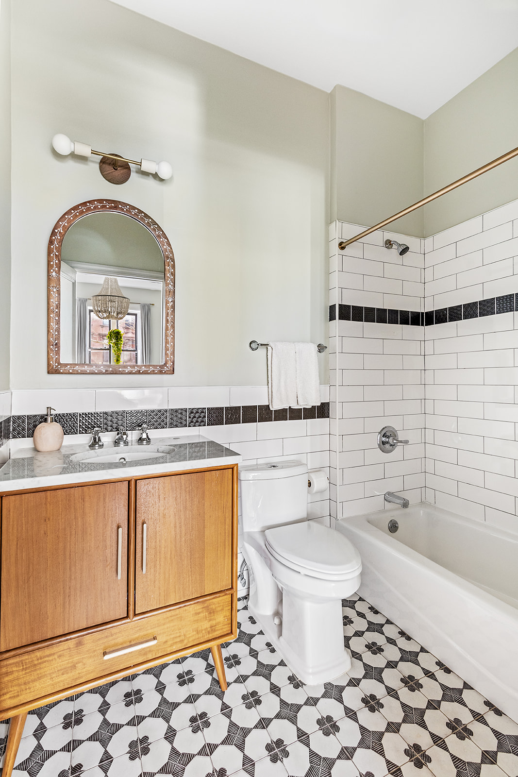 331 A Stuyvesant Avenue Brooklyn, NY 11233 - Photo 19 of 21 a bathroom with a sink toilet and mirror