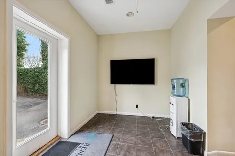 a kitchen with a refrigerator and a stove