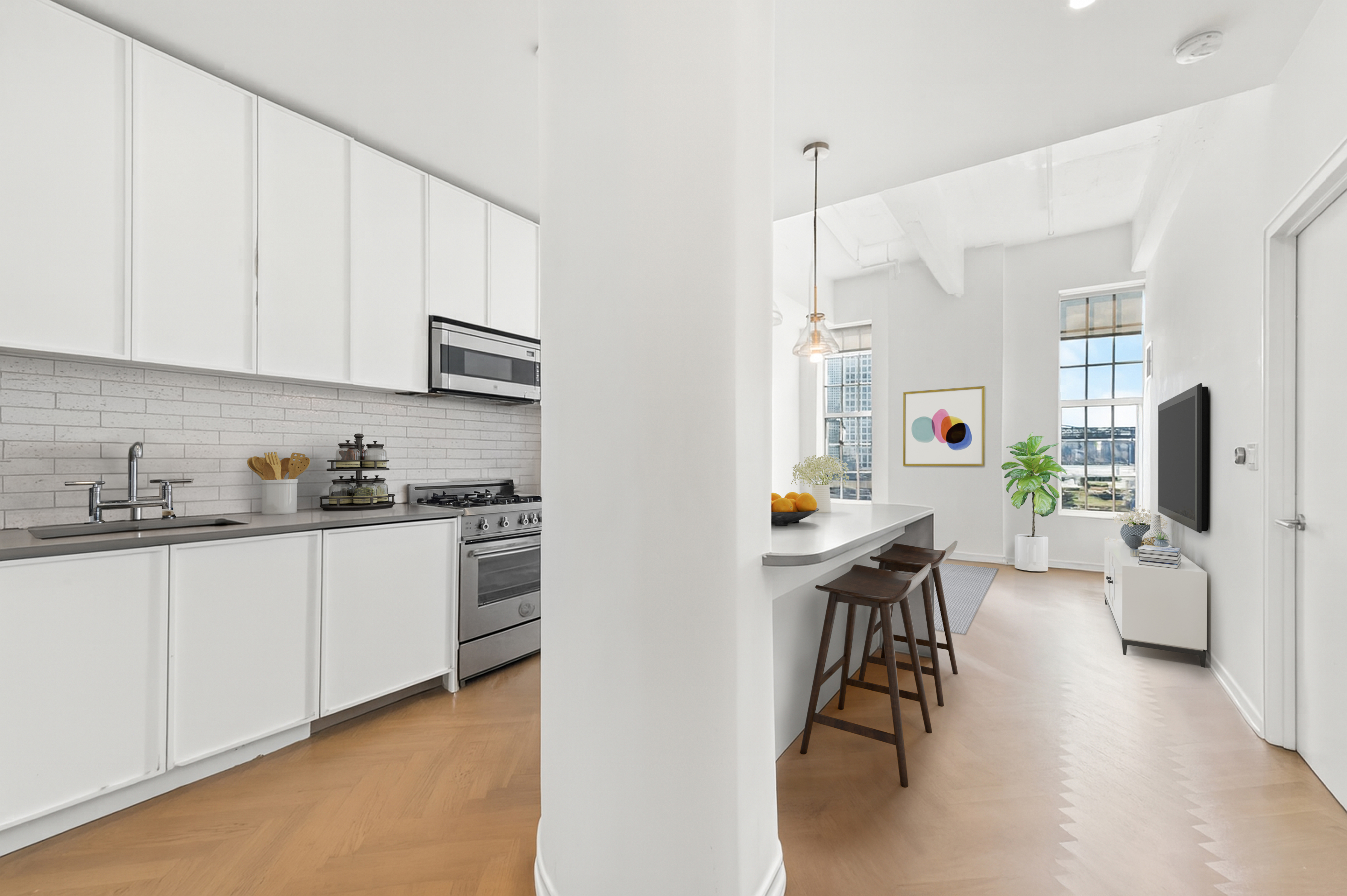 184 Kent Avenue, Unit B407 Brooklyn, NY 11249 - Photo 2 of 14 a kitchen with stainless steel appliances a stove a sink a refrigerator a table and chairs