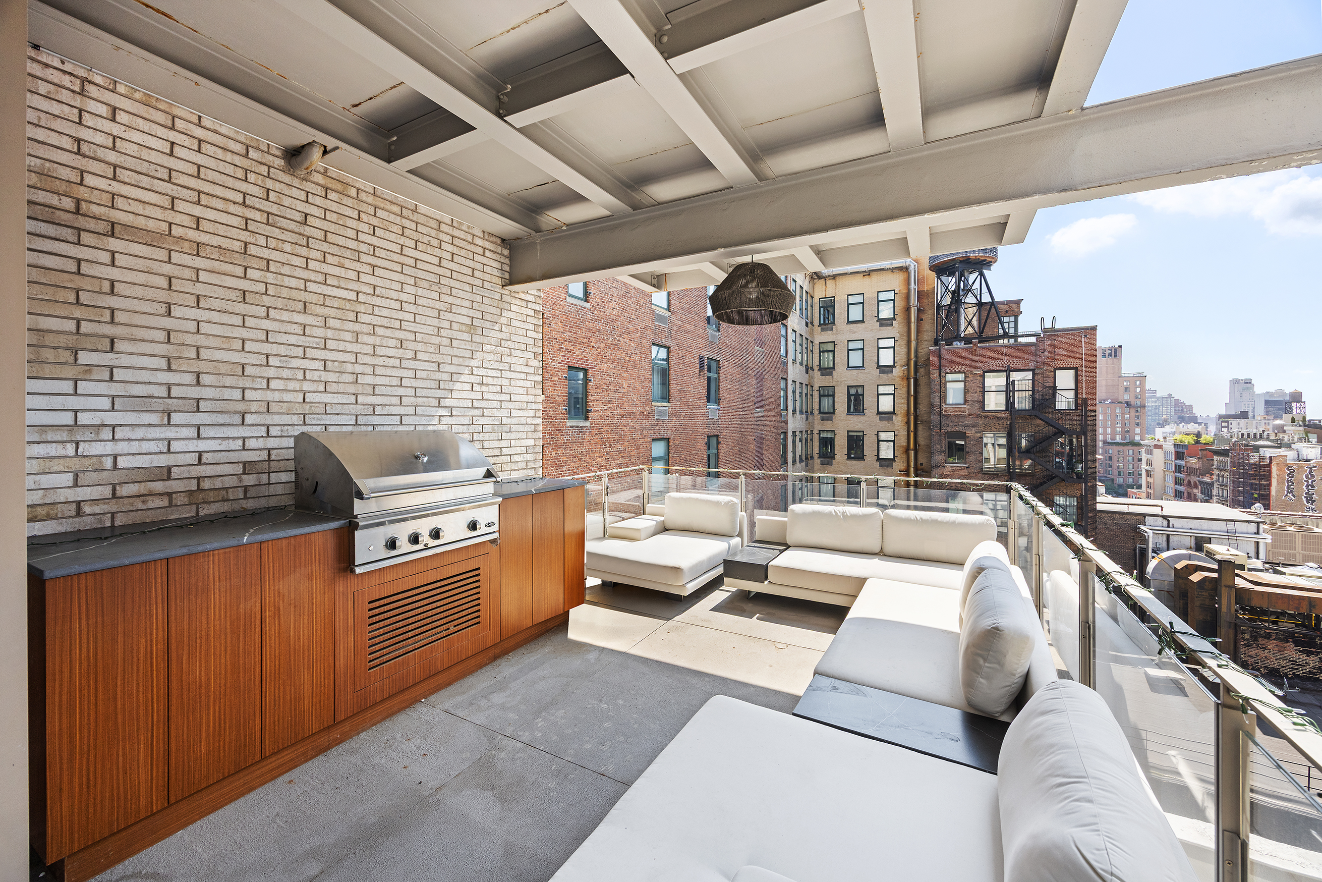 1 Great Jones Alley, Unit 10 Manhattan, NY 10012 - Photo 7 of 41 a living room with patio furniture and a fireplace