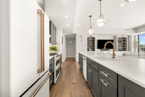 a spacious bathroom with a sink and a mirror