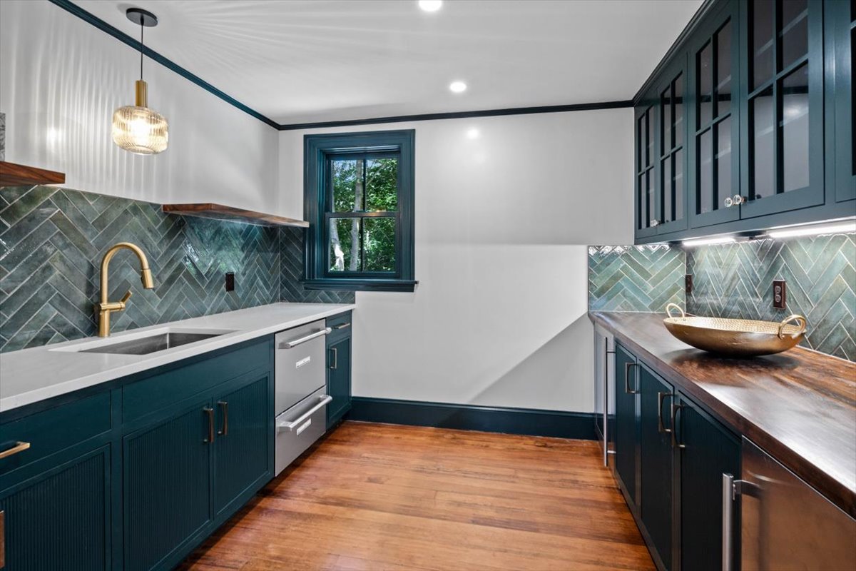 49 Garrison Road Hingham, MA 02043 - Photo 10 of 30 a kitchen with stainless steel appliances granite countertop a sink and a stove