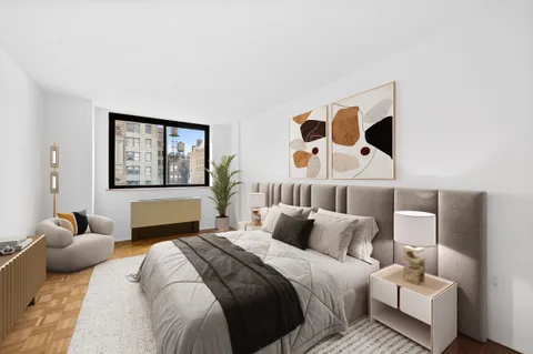 a bedroom with a bed and wall painting