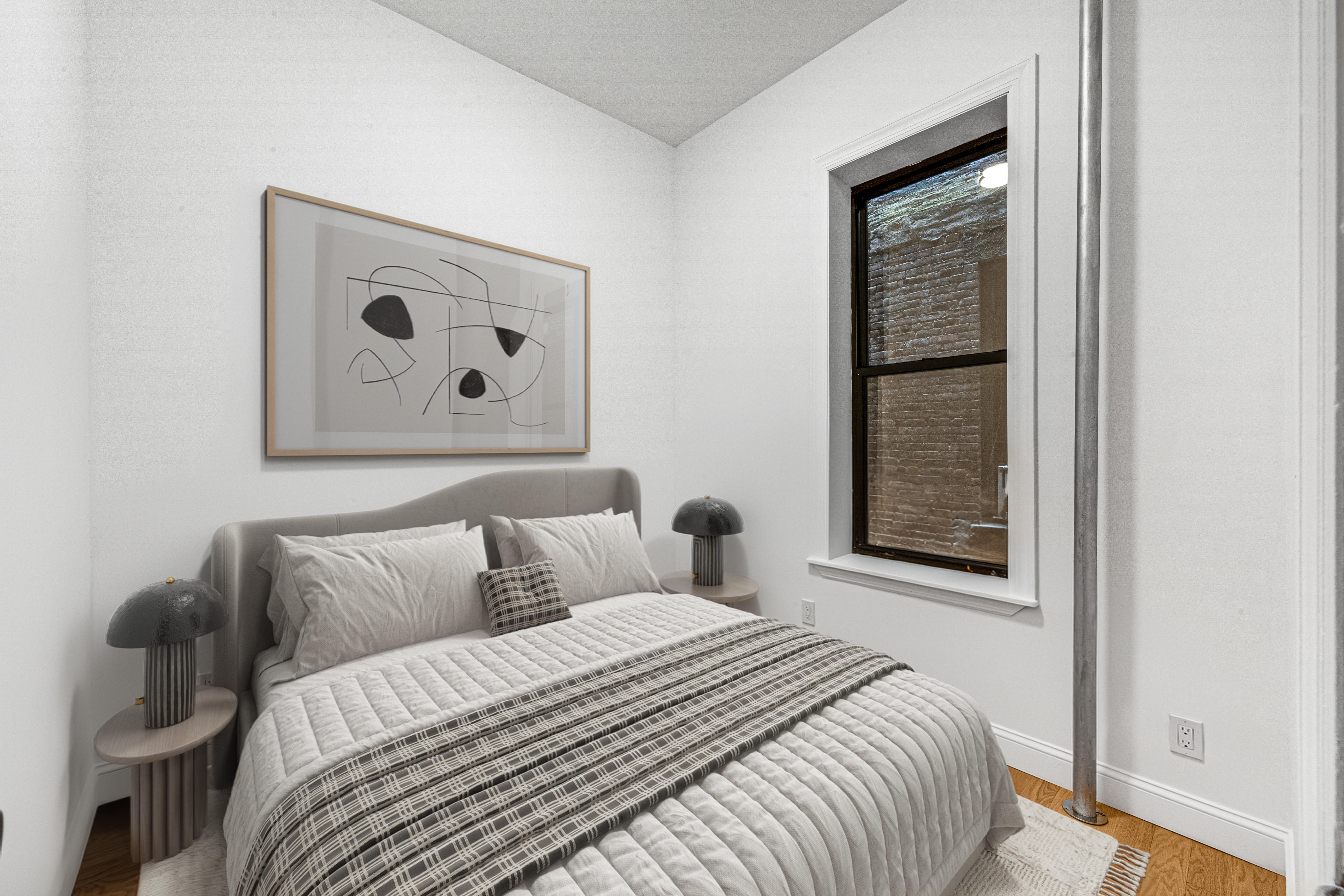 304 East 11th Street, Unit 1C Manhattan, NY 10003 - Photo 3 of 16 a bedroom with a bed and a window
