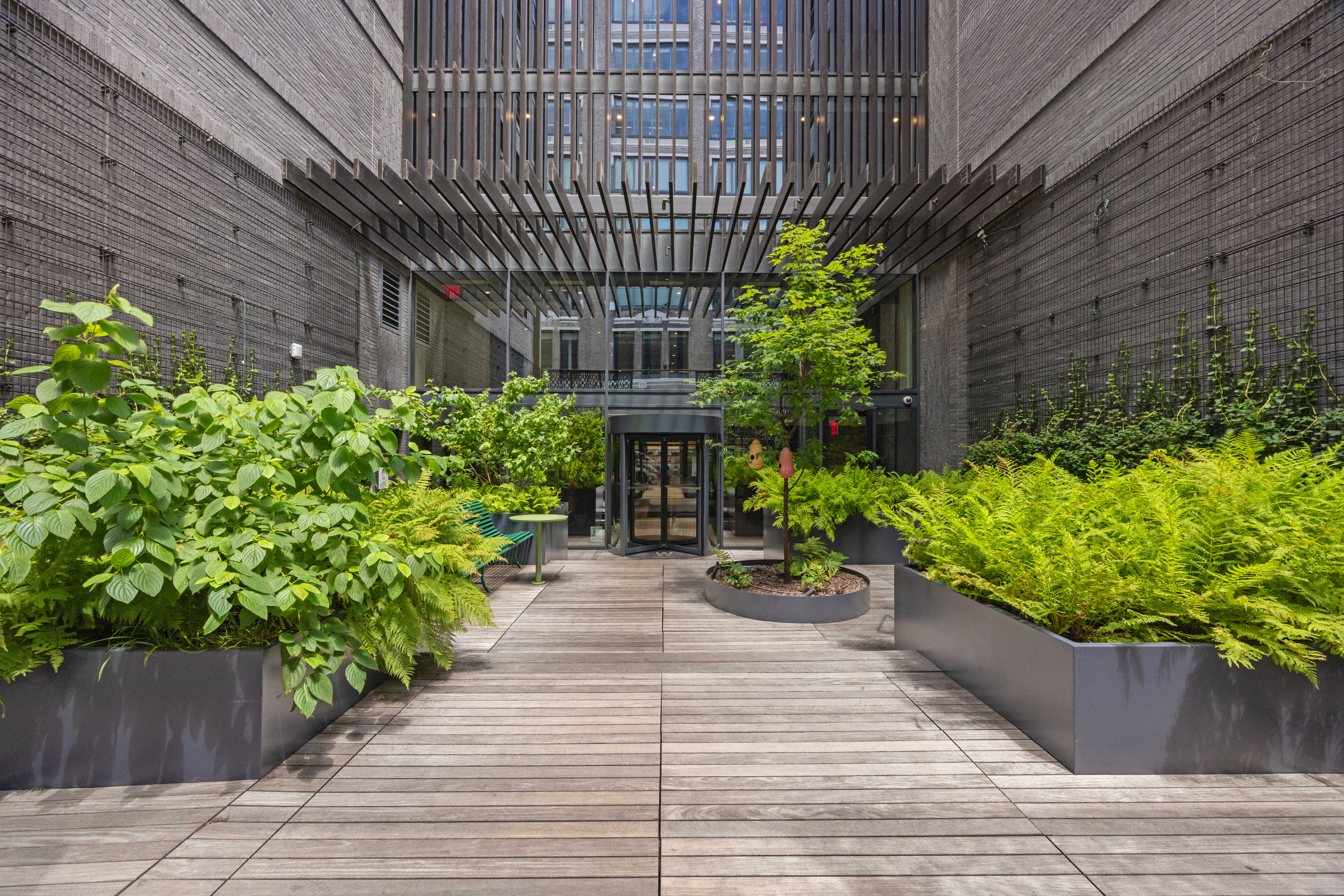 547 West 47th Street, Unit 509 Manhattan, NY 10036 - Photo 26 of 29 a front view of a house with plants